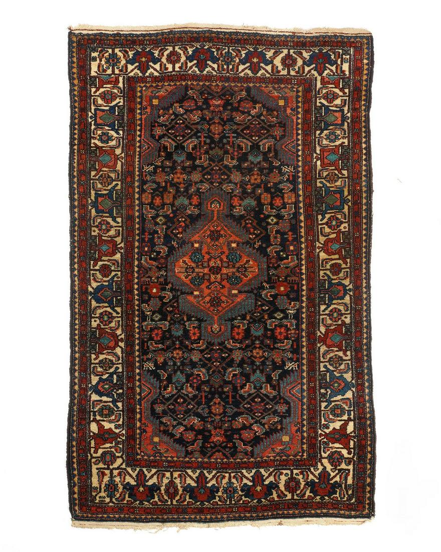 Antique Persian Hamadan Rug: Five floral and geometric border bands, black center field, stylized floral motif, center salmon ground medallion, 4' 4" x 6' 9". Condition: Fringe wear.