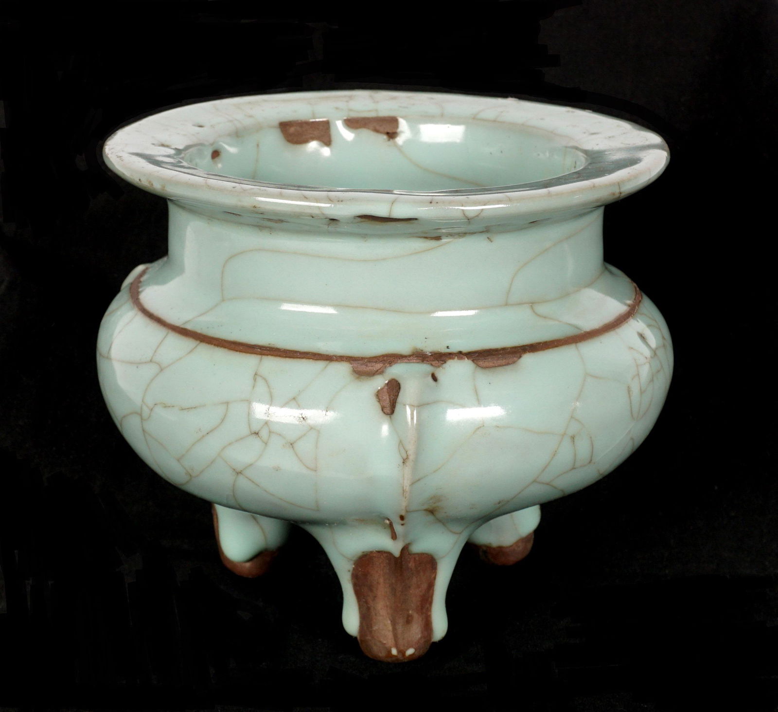 Chinese Celadon Guan Style Tripod Censer: Guan style celadon crackle glaze tripod censer, overall 5" h. x 6" dia. Condition: Glaze flaws.