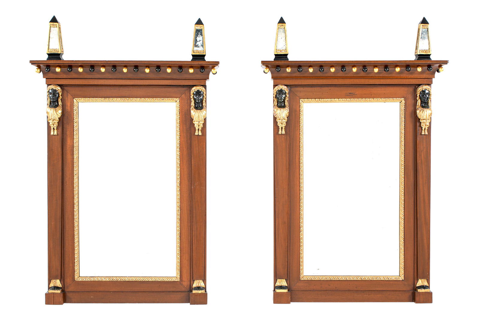 Pair Italian Empire Figural Mirrors: Ebonized and giltwood mirrored obelisk finials over mahogany frame. Carved ebonized and giltwood caryatid busts over lower feet, overall 43.5" h. x 28.25" x 3.75".