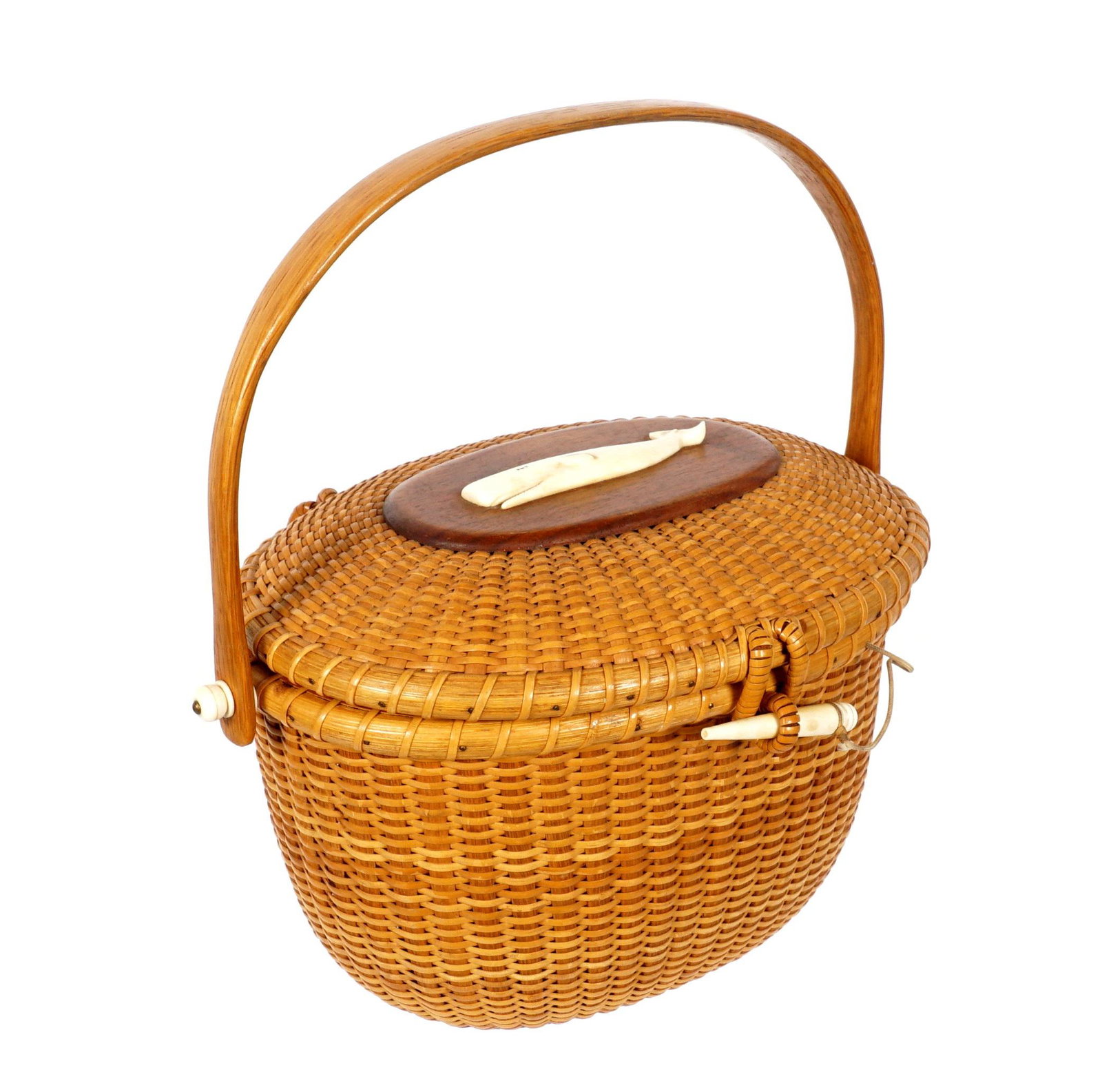 Bill and Judy Sayle Nantucket Basket Purse: Oval covered woven basket, swing handle, figural sperm whale on lid. Signed and dated 1980 on base. Overall 6.5" h. x 10.5" x 7.
