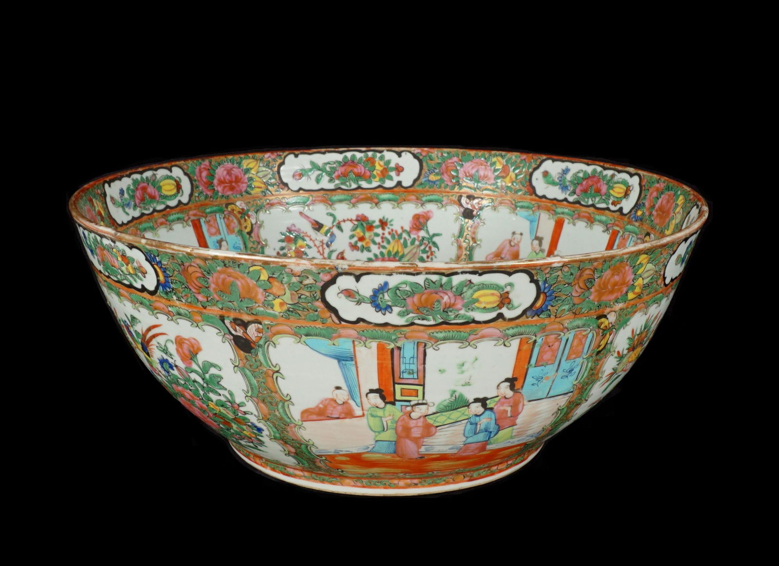 Chinese Rose Medallion Porcelain Center Bowl: Large porcelain center / punch bowl decorated in typical Rose Medallion motifs, unmarked, 6.5" h. x 15.75". Condition: Minor loss to gilt.
