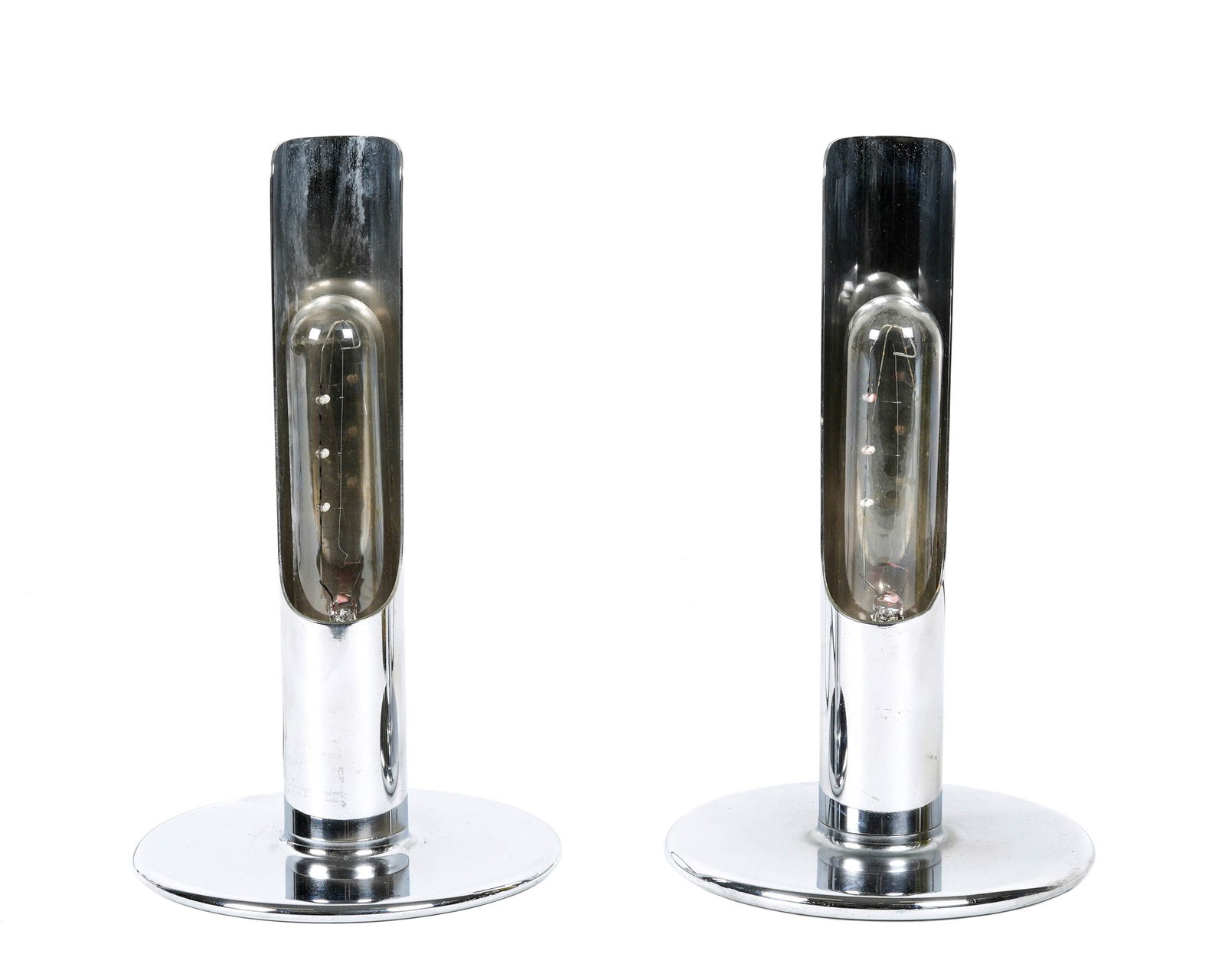 Pair Ingo Maurer for Design M Prix Chrome Lamps: Two Ingo Maurer for Design M "Prix" table lamps, chrome metal, single socket fixtures, 9.5" h. x 5.5" base dia. Condition: Spotting to chrome.