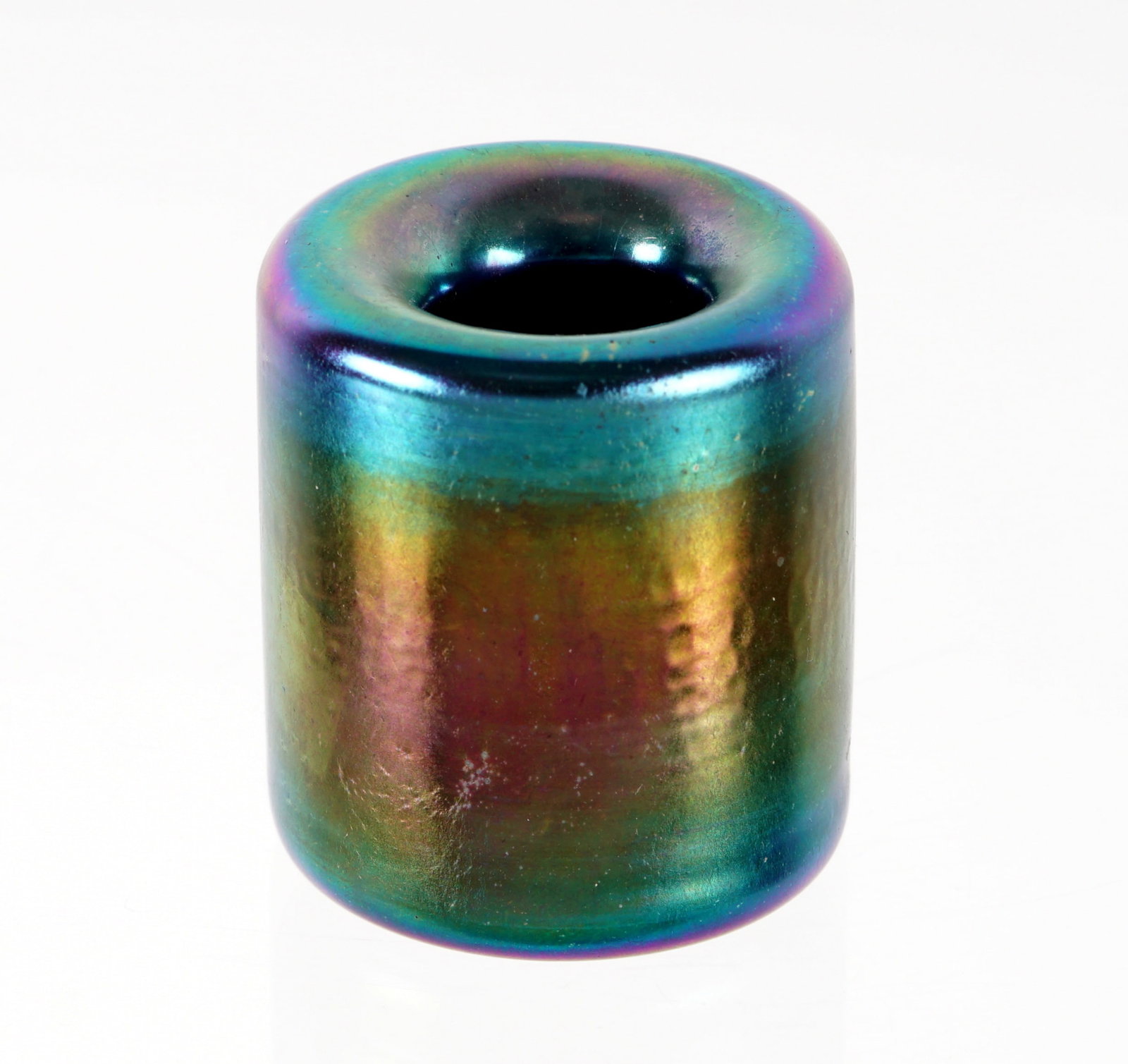 Tiffany Blue Favrile Glass Inkwell 5491B: Iridescent blue Favrile glass diminutive cylinder form inkwell with interior rolled rim, marked L. C. Tiffany 5491B and original paper label. Overall 2" h. x 1.75" dia. Condition: Minor scratches.