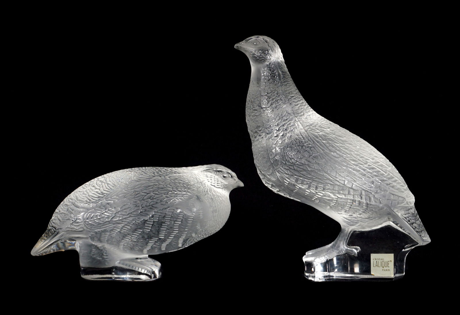Pair Lalique Crystal Perdix Partridge Sculptures: Two pieces total frosted and molded crystal each signed Lalique France, to include 1) Standing partridge, 7" h. x 5.5" x 3". Note chip under base. 2) Squat partridge, 3.25" h. x 6.5' x 3".
