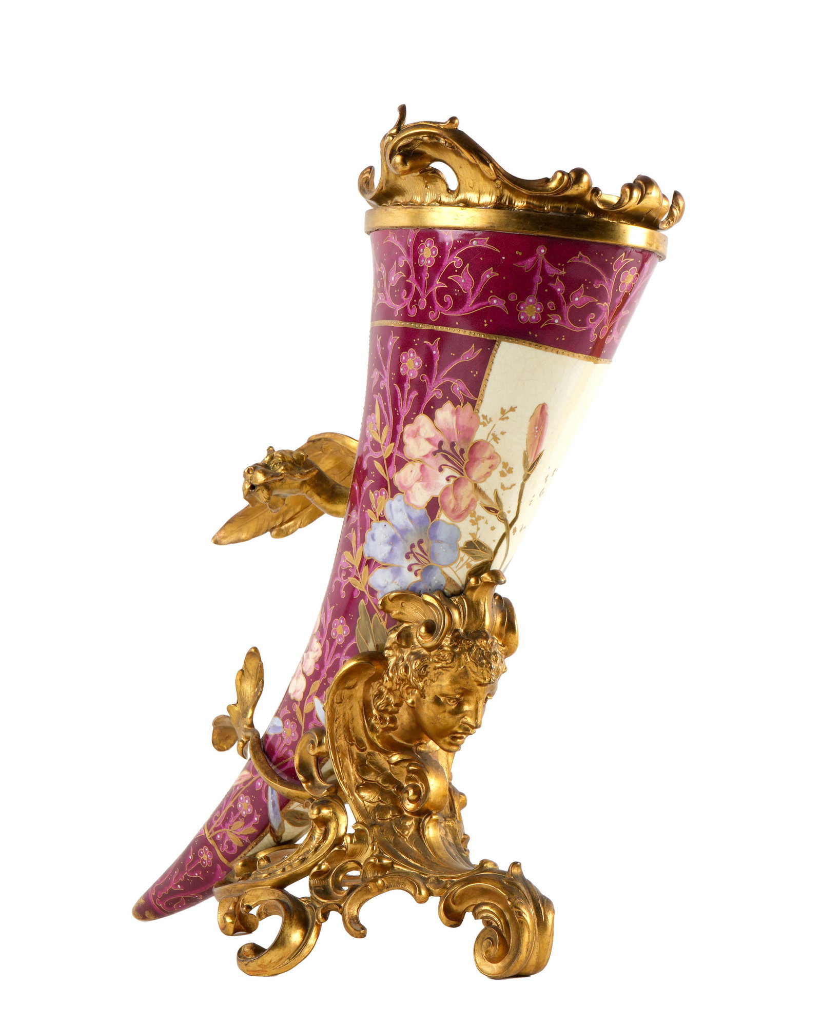 Royal Bonn Porcelain Bronze Mounted Cornucopia: Royal Bonn hand painted cornucopia or horn of plenty, well marked inside horn. Gilt bronze mounted with figural dragon, mask, and foliate scroll. Overall 13.25" h. x 10.25" x 7". Condition: Crazing, w