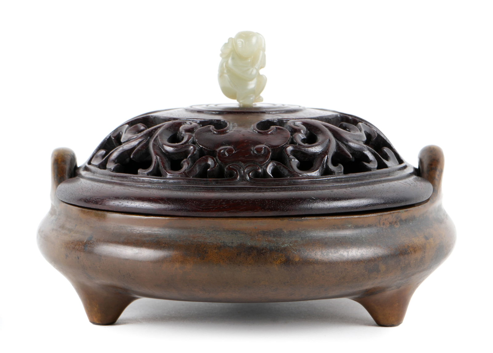 Chinese Bronze Tripod Censer with Lid: Bronze tripod censer with two handles, reticulated pierced wood lid, carved jade figural man finial. Bears nine character Xuande mark to base. Overall 3.75" to top of finial. 5.5" dia. Condition: Fini