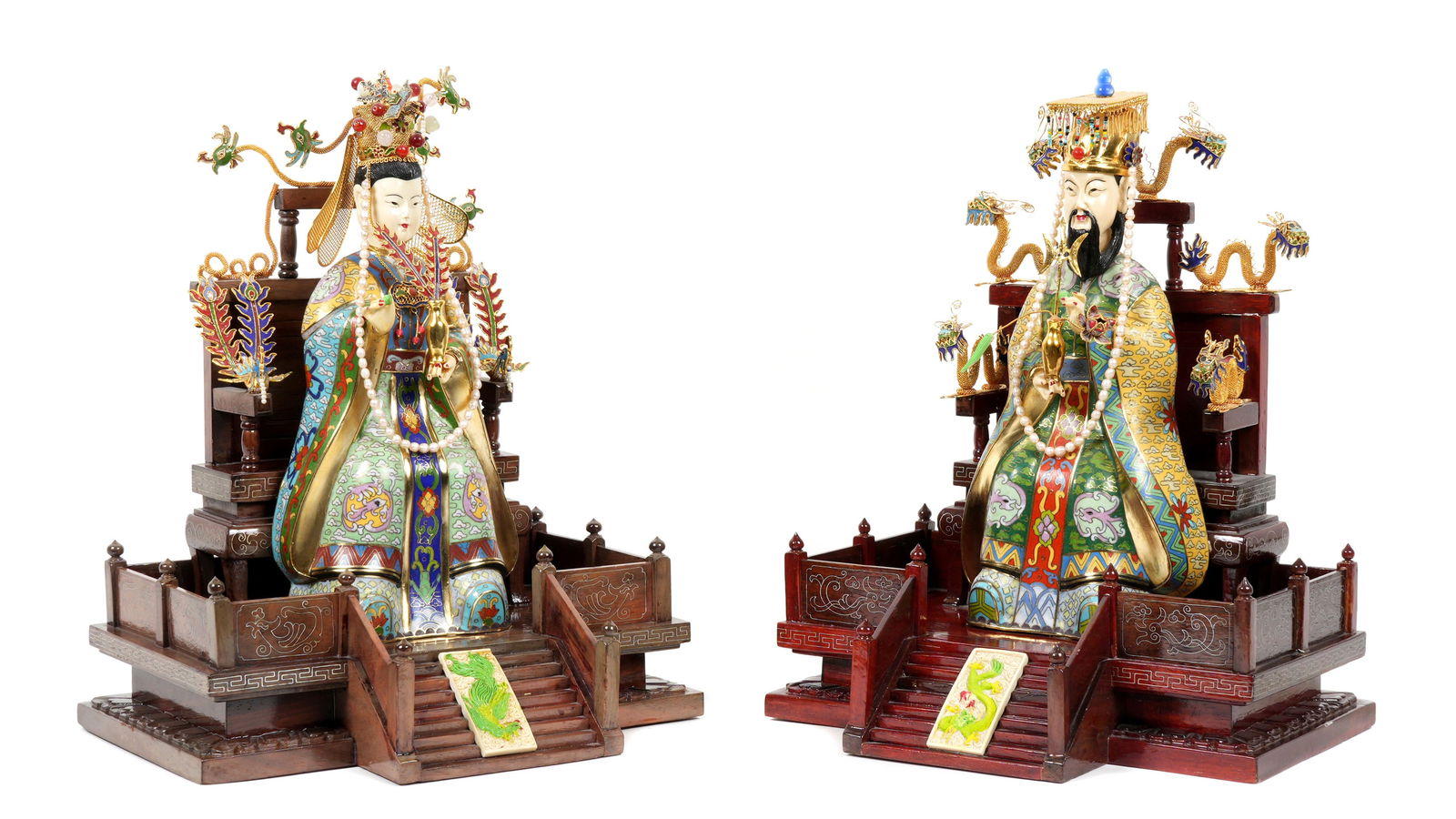 Pair Chinese Cloisonne Seated Emperor & Empress: Large pair of cloisonne decorated seated royal figures on wood thrones with brass inlay, figural brass dragons, plaque on steps to throne. The emperor holding a jar with flowers and ornaments, the emp