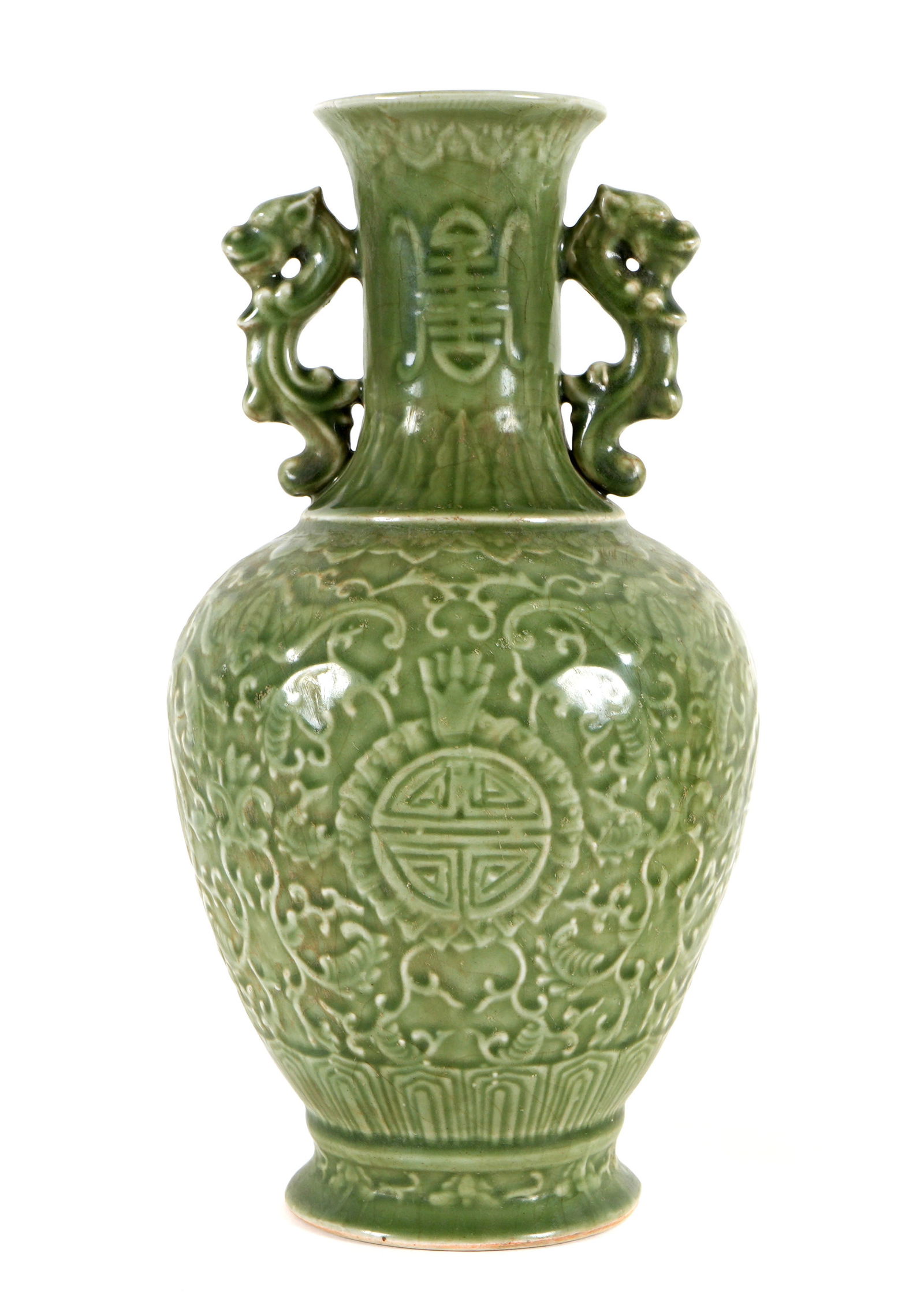 Chinese Celadon Glaze Molded Vase: Baluster form porcelain vase with applied stylized dragon handles. Crackle celadon glaze, raised floral decoration and Shou characters, unglazed foot. Overall 13.25" h. x 6.75".