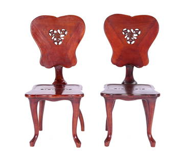 Pair Style of Antoni Gaudi Calvert Side Chairs: In the style of Antoni Gaudi (Spanish, 182-1926), pair of "Calvert" carved rosewood side chairs, reticulated shield backs and seats, carved and shaped back supports, shaped legs. Unmarked, overall 41.