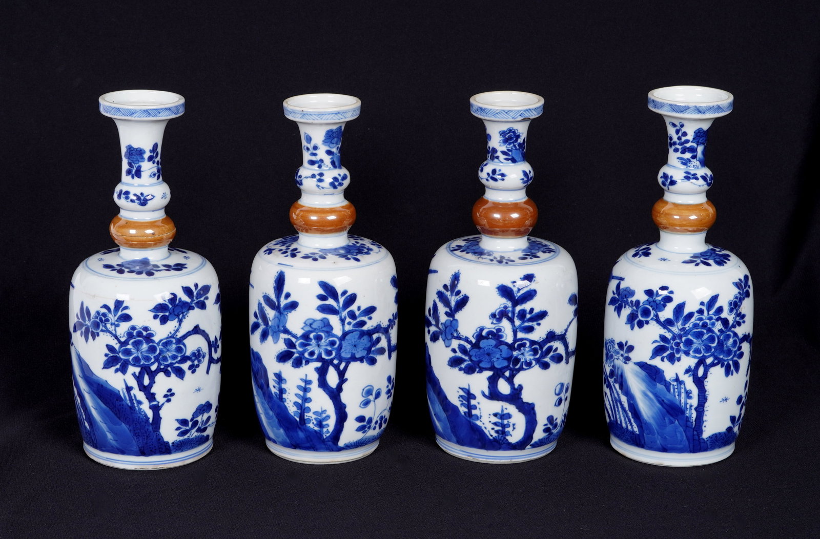 Four Chinese Blue and White Porcelain Bottle Vases: Four pieces total, each blue and white decorated with landscapes, floral, and birds. Unmarked, overall 7.75" h. x 3" dia. Note glaze flaws.