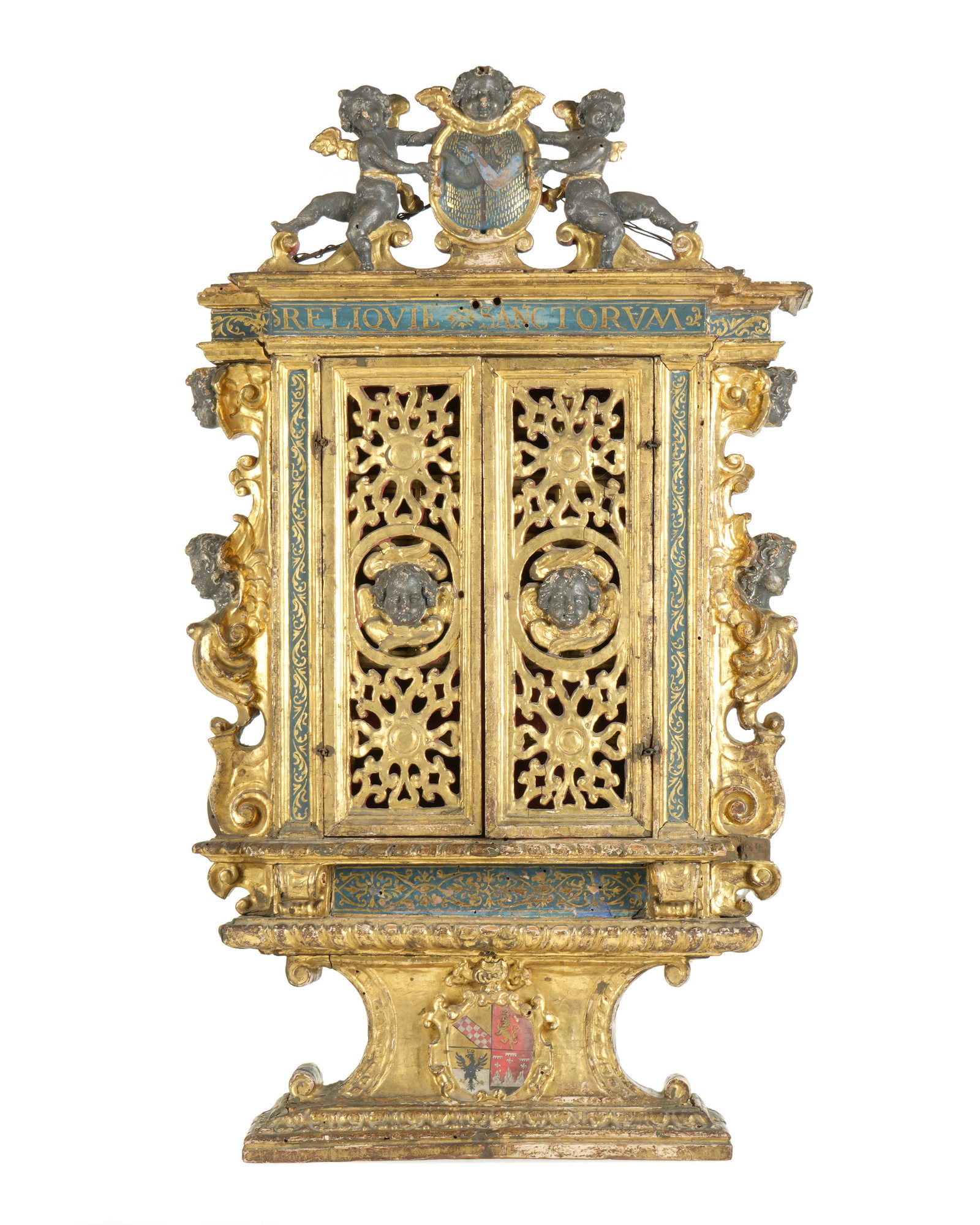 16th/17th Italian Franciscan Carved Gilt Reliquary: 16th / 17th Century Baroque carved giltwood and polychrome paint decorated reliquary cabinet. Carved crest with figural cherubs holding center crest with Franciscan Order emblem over cornice with "REL
