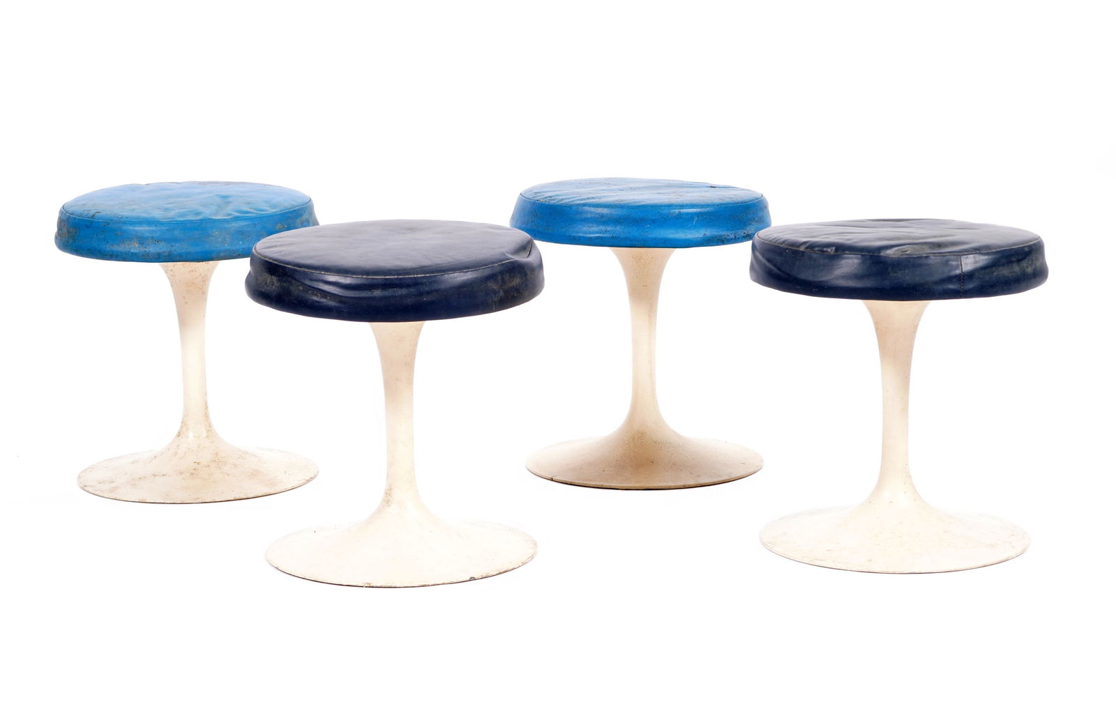 Four Eero Saarinen for Knoll BR51 Tulip Stools: Four model BR51 "Tulip" stools designed by Eero Sarrinen for Knoll, white enamel aluminum bodies, blue vinyl upholstery. Each with raised BR 51 under base. Overall 15.5" h. x 14" dia. Condition: In ne