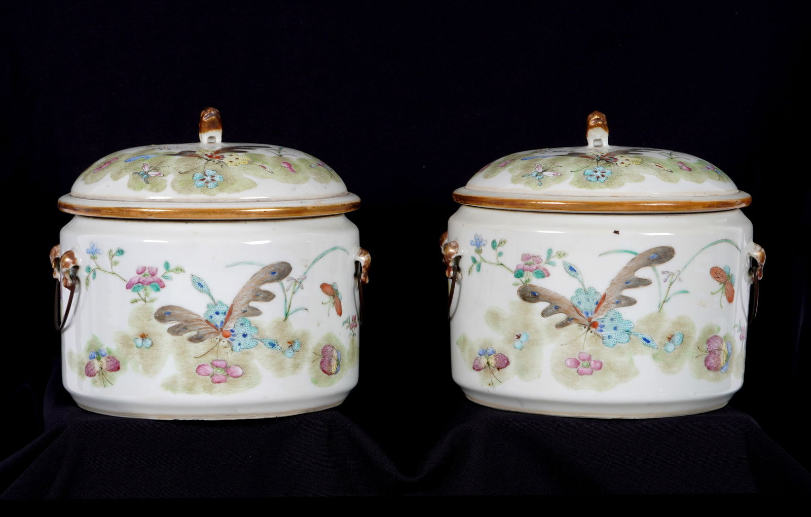 Pair Chinese Famille Rose Porcelain Picnic Bowls: Pair round porcelain picnic bowls, covers with foo dog finials, butterflies and flowers decoration. Bodies with matching decoration, copper handles, removable inner bowl. No visible markings. Overall