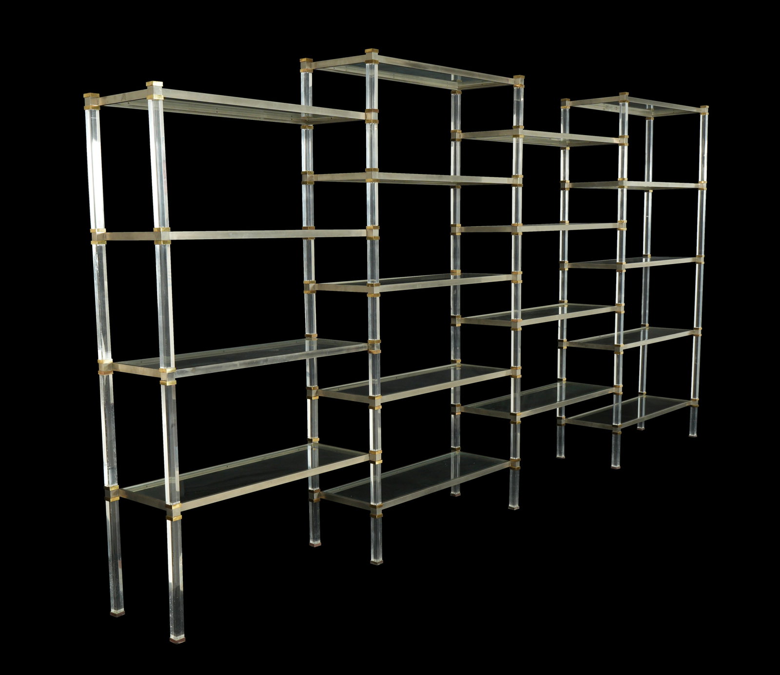 attributed John Vesey Large Multi Section Etagere: Brushed aluminum, brass, and Lucite frame, glass shelves. 18 alternating height sections, attributed to John Vesey. Overall assembled measures 73.75" h. x 147" long x 14.25". Condition: Blemishes to L