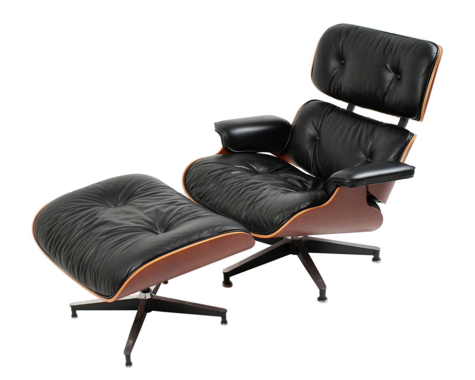 2003 Eames Lounge Chair & Ottoman Herman Miller: Herman Miller for Charles & Ray Eames lounge chair and ottoman. Rosewood veneer molded frames, metal legs, original black leather upholstery. Labeled under chair seat, chair measures 33" h. x 33" x 33