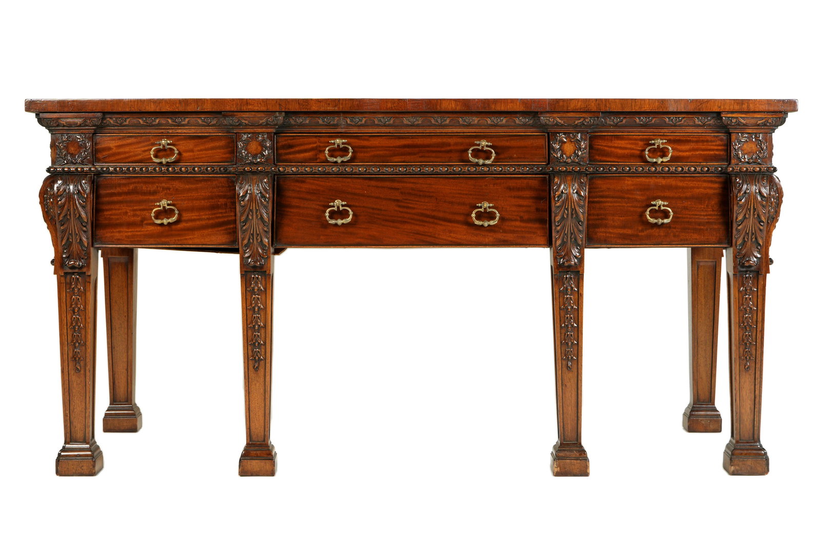 English Carved Mahogany Irish Styled Sideboard: Banded mahogany top over six drawers, carved foliate stiles, legs with trailing bellflowers. Overall 33" h. x 66.5" x 27.75". Condition: Scratches to top, other wear consistent with age and everyday u