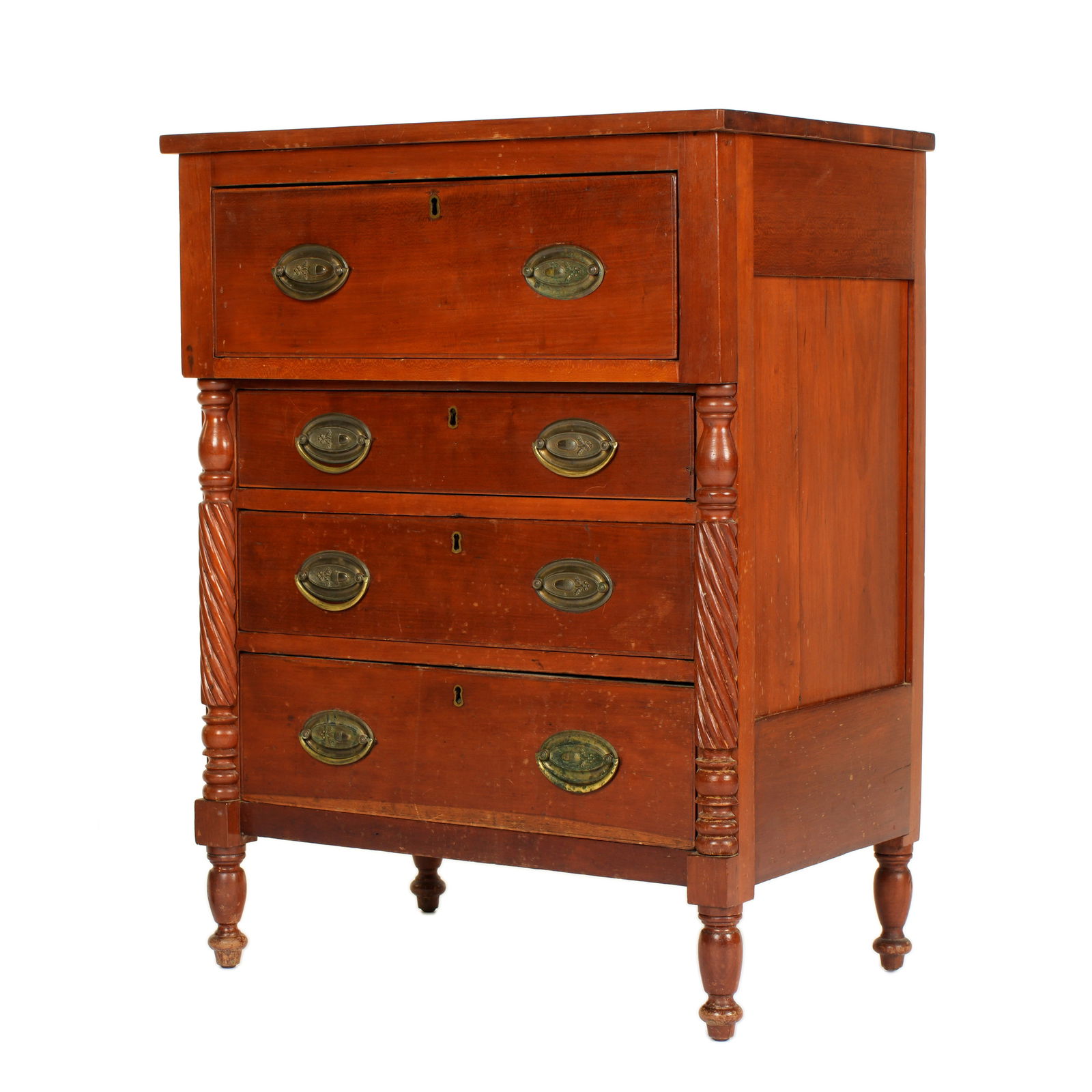 Circa 1840 American Cherry Miniature Chest: 19th Century miniature cherry four drawer chest with turned half column stiles, oval brass pulls, turned legs. Overall 30.75" h. x 23.25" x 15.75". Condition: Two pulls missing handles. Scratches, din