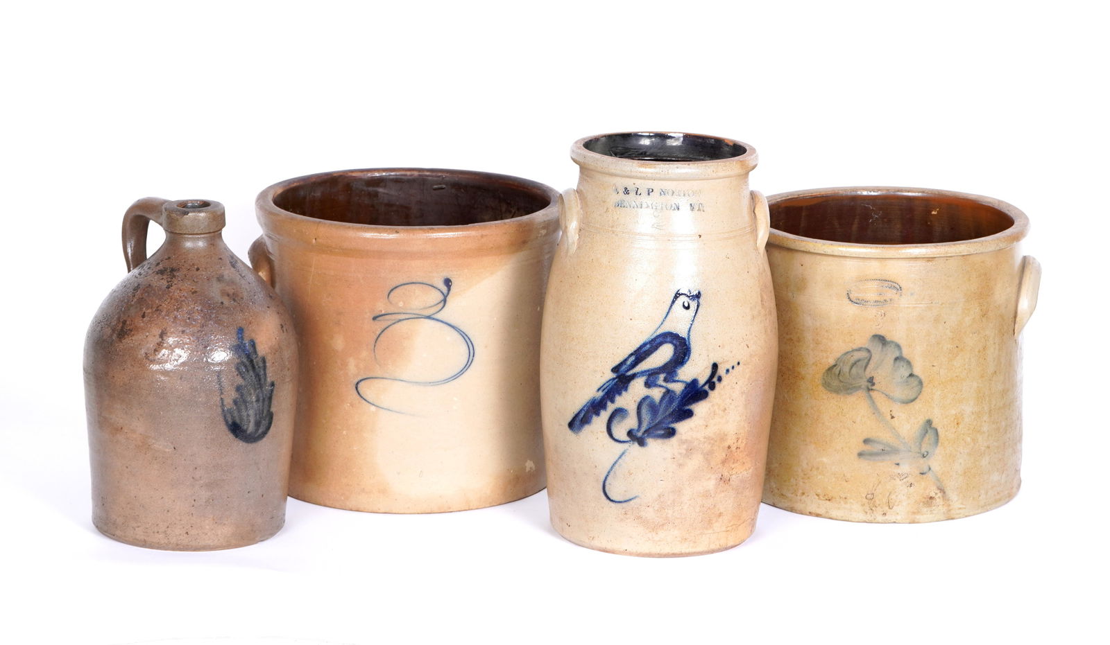 Four Salt Glazed Stoneware Crocks & Jug: Four pieces total to include 1) E. & L. P. Norton 2 gallon crock, blue bird on branch decoration, overall 13.5 h. x 7.25". Rim chip. 2) A. E. Smith & Sons 3 gallon crock, flower decoration. 10.25" h.