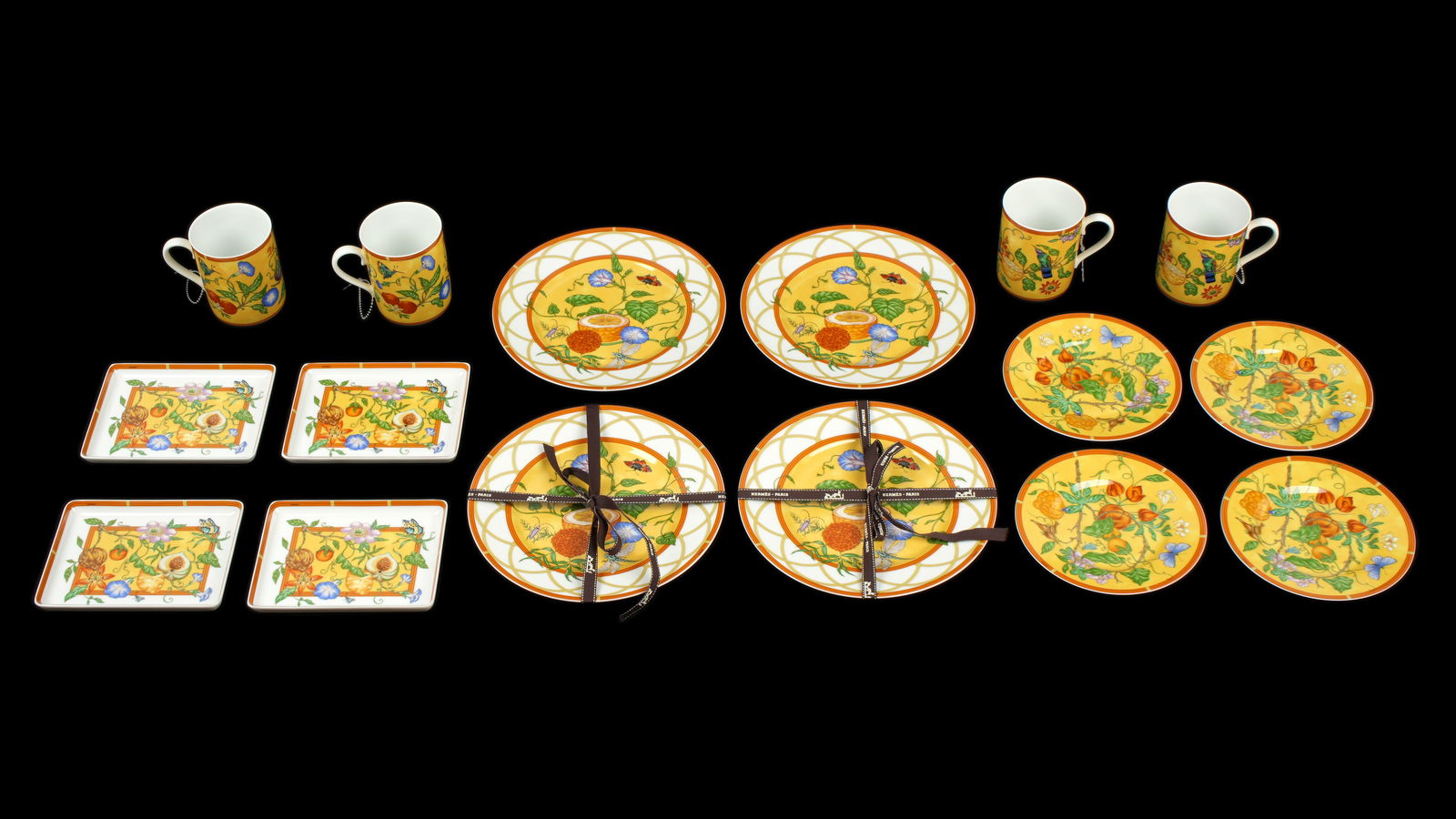 16 Hermes La Siesta Porcelain Service Pieces: Sixteen pieces total in the La Siesta pattern by Hermes to include 4 dessert plates (9" dia, sold with 2 boxes), 4 bread plates (6.5" dia.), 4 small rectangular(sushi) trays (6.25" x 4.75"), 4 coffee