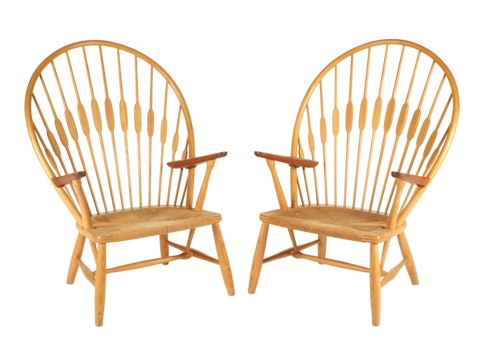 Pair Hans Wegner for Hansen Peacock Chairs: Hans Wegner for Johannes Hansen "Peacock" chairs, ash frames with teak arms, braided cord seats, "Johannes Hansen Copenhagen Denmark" brand under seats. Overall 41.75" h. x 30" x 28.5". Condition: Cra