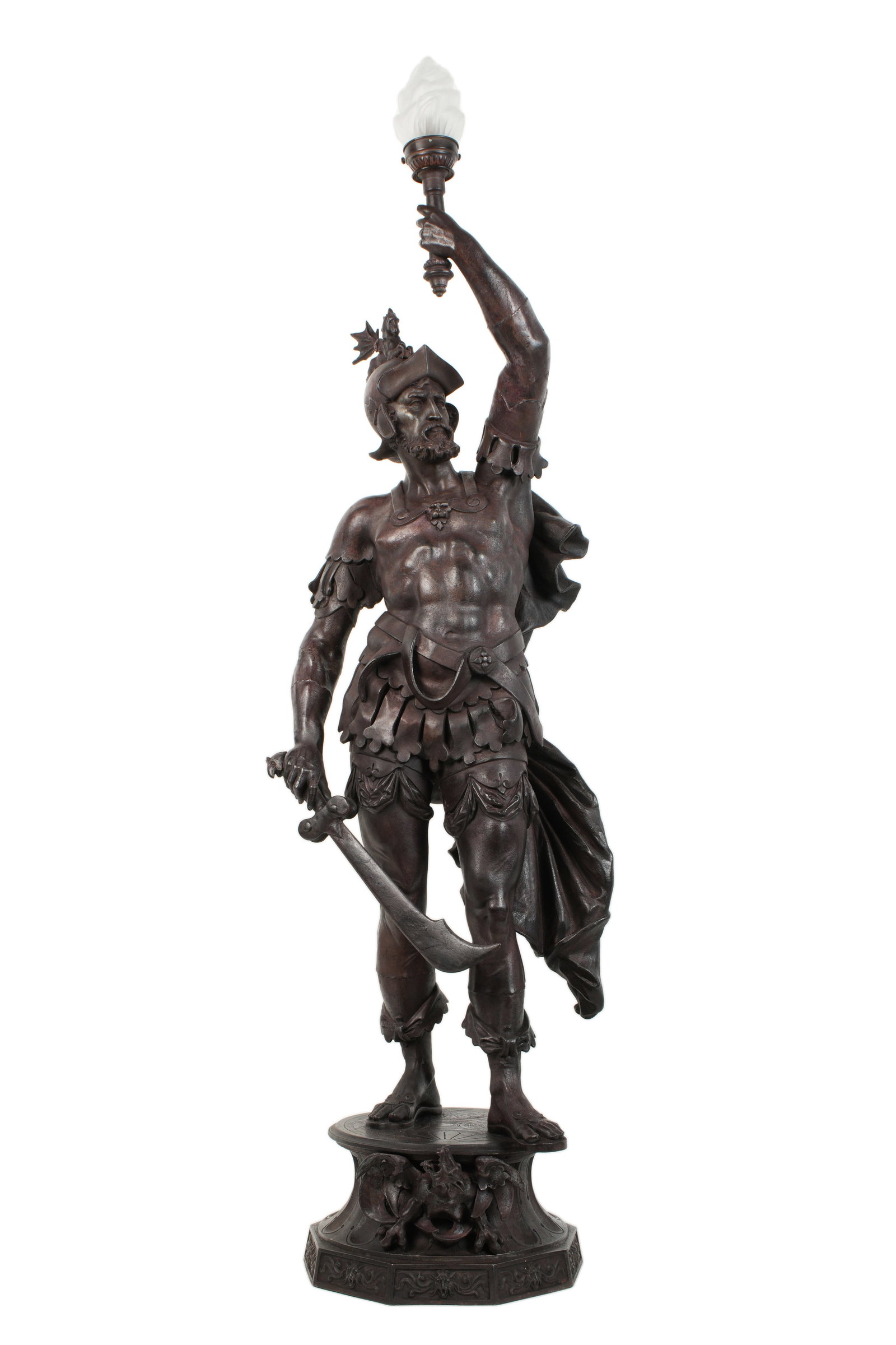 Large Spelter Figural Spanish Soldier Lamp: Painted metal figure of a Spanish conquistador or soldier holding a sword in one hand, other arm raised to hold single socket fixture with frosted glass flame shade. Base with figural dragon, overall