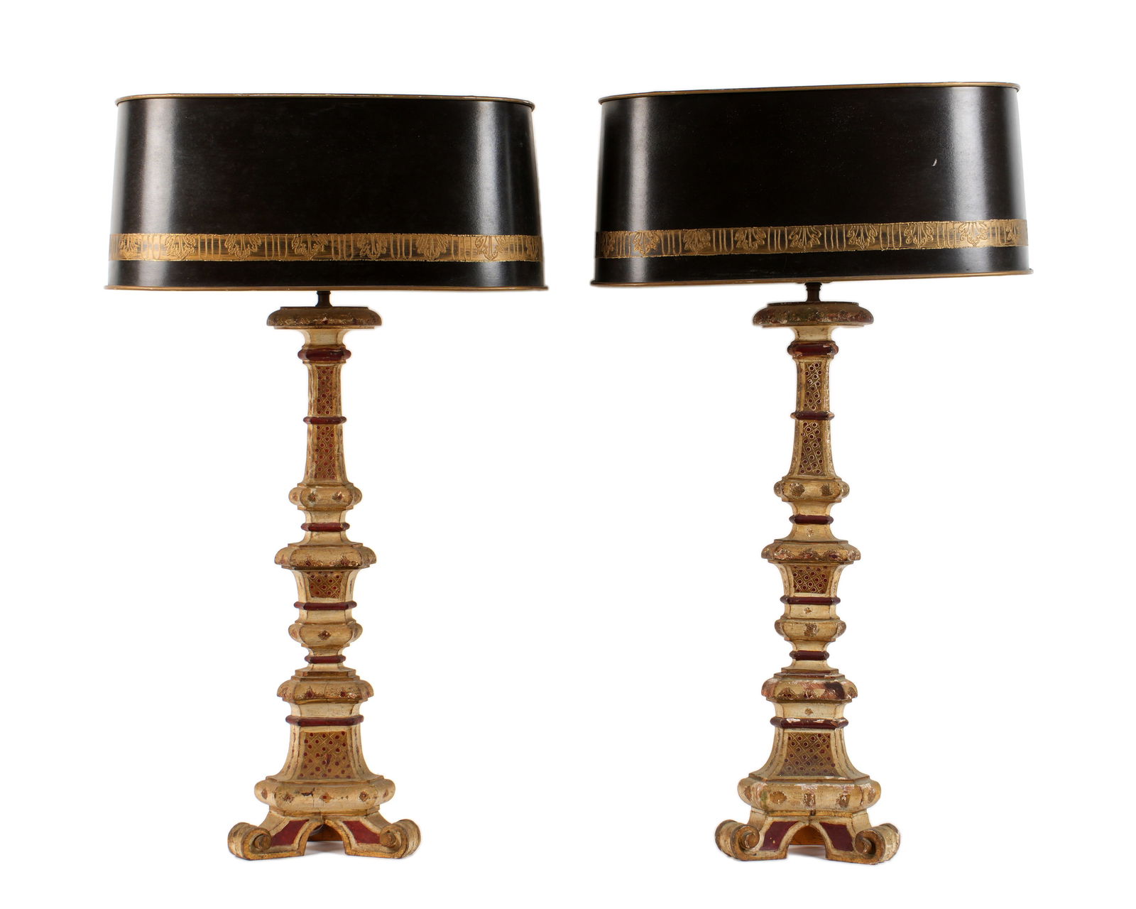 Pair Italian Carved & Painted Wood Pricket Lamps: Carved and painted wood pricket bases, single socket fixtures, Older Made in Italy paper labels to bases. Sold with black heavy paper shades with gilt decorated band. Bases 32.5" h. to top of harp x 8