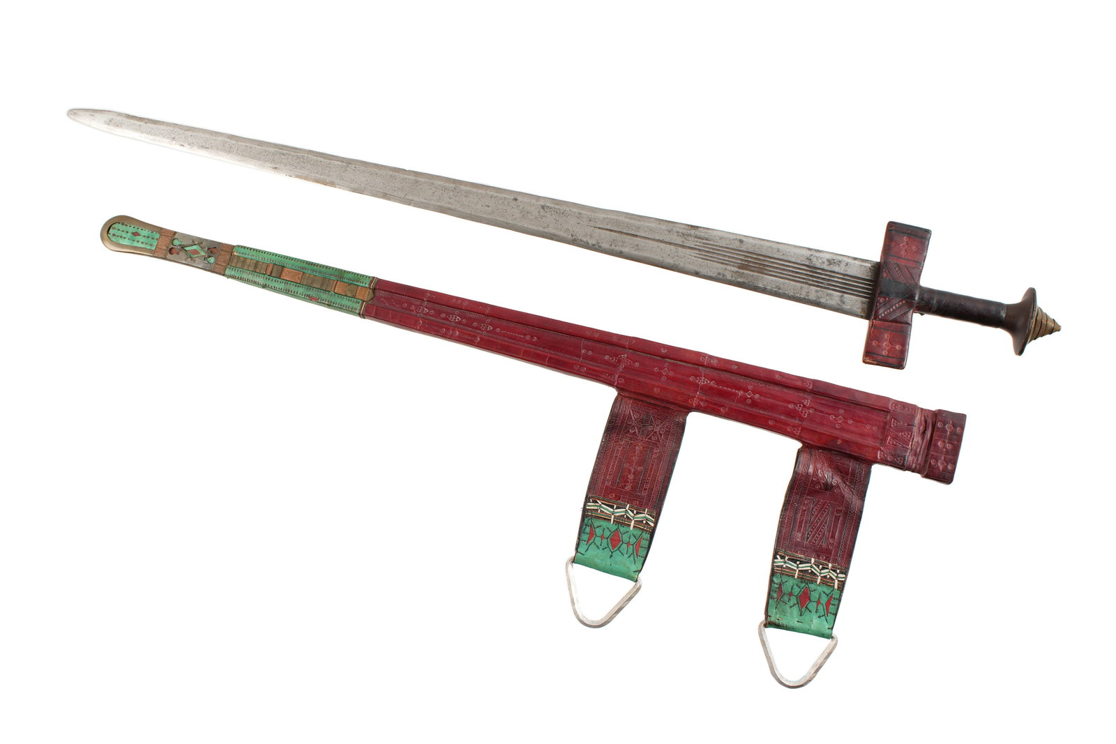 North African Tuareg Takouba Sword and Scabbard: Stepped brass pommel, leather wrapped grip and guard. 29" double sided straight blade with five fullers, unmarked. Embossed red leather scabbard with metal accented drag. Embossed leather hangers. Fro