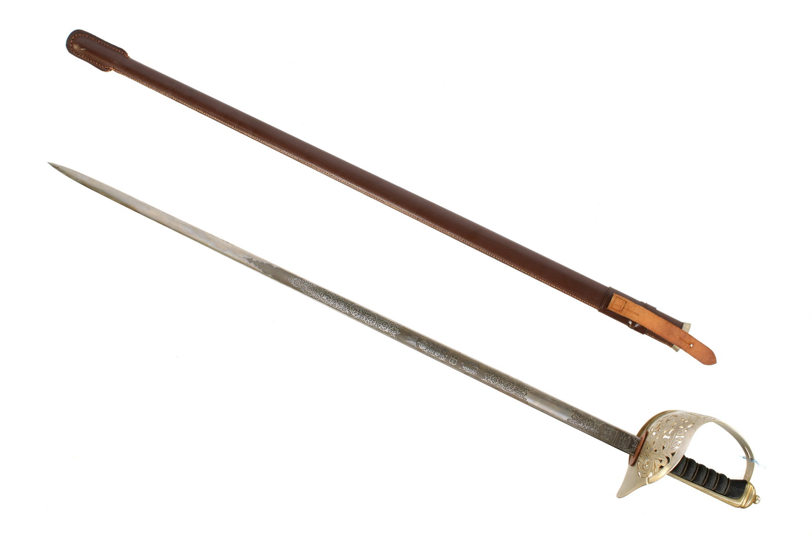 Wilkinson Edward VIII Infantry Officers Sword: Nickeled steel hilt, large foliate scroll reticulated guard bearing the crest of King Edward VIII, etched 32.5" blade well marked, foliate scroll and Edward VIII crest on either side. Serial number on
