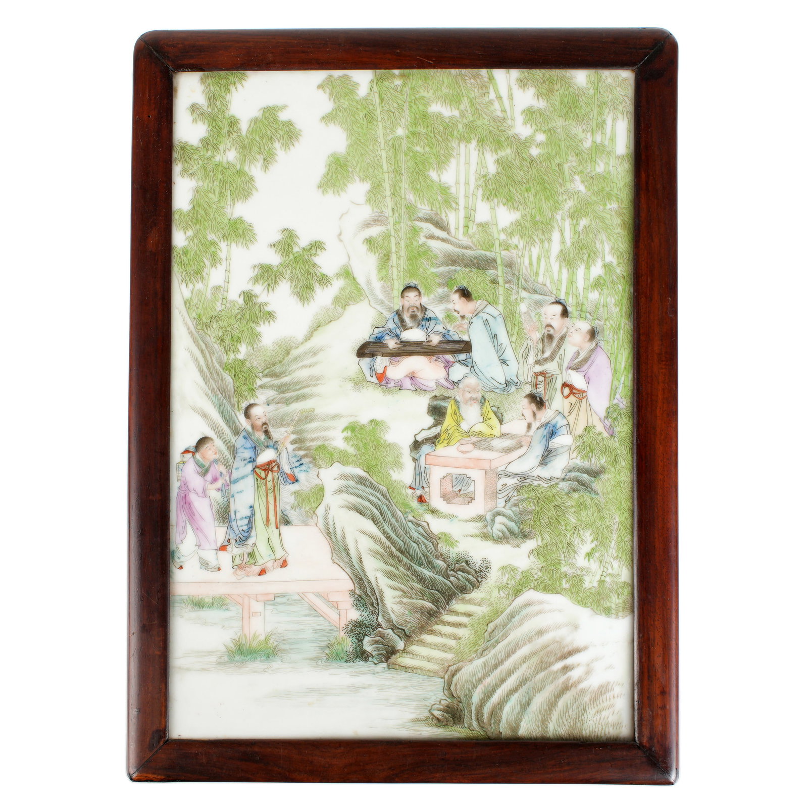 Chinese Republic Famille Rose Porcelain Plaque: Famille rose decorated porcelain plaque depicting figures in a bamboo forest, no visible signature or markings, 13.25" x 9.25", framed 15" x 11". No condition issues noted under black light.