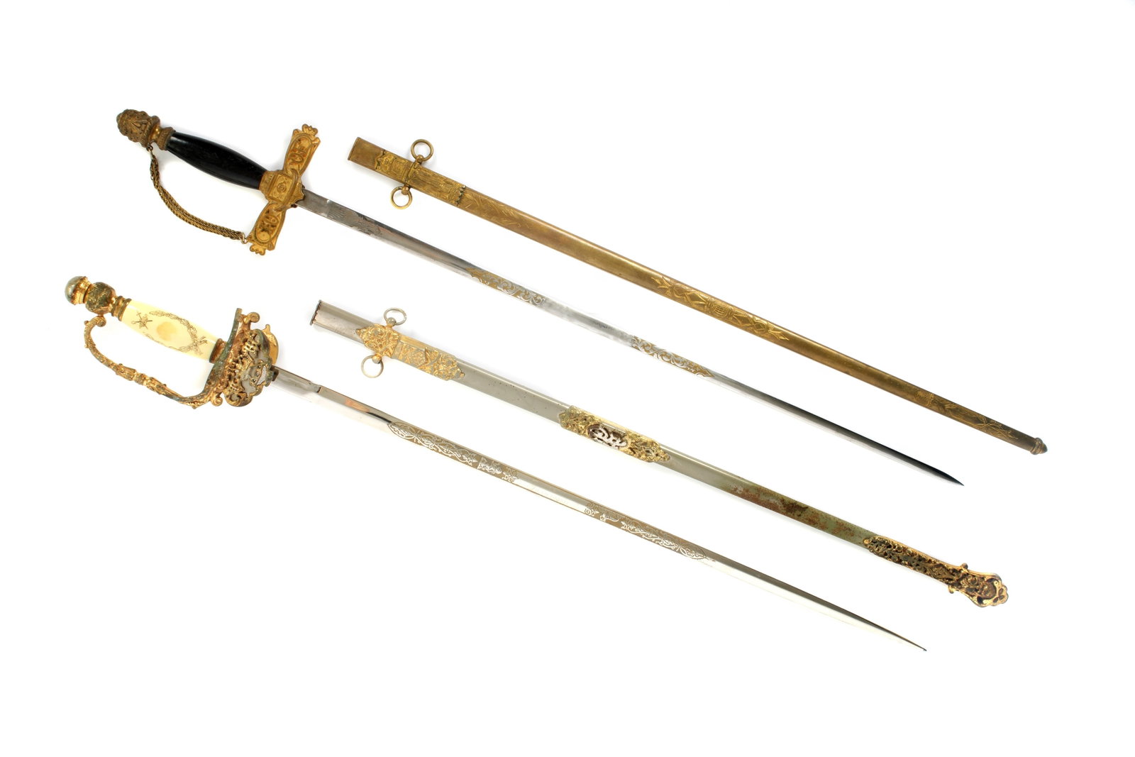 Two Odd Fellows Fraternal Lodge Swords: Two pieces total, Patriarchs Militant Odds Fellows swords, one Ames. the other unmarked, both with etched blades. Unmarked example sold with a leather carrying case. Longer measures 37" long in scabba