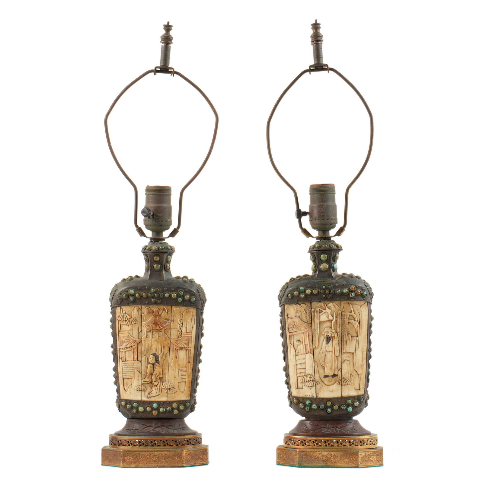 Antique Chinese Carved Bone Turquoise Metal Lamps: Pair antique Chinese lamps, bottle form metal bodies with carved bone inset plaques, cabochon inset turquoise, jade, and other stones. Embossed brass base. Single socket fixture. Overall including har