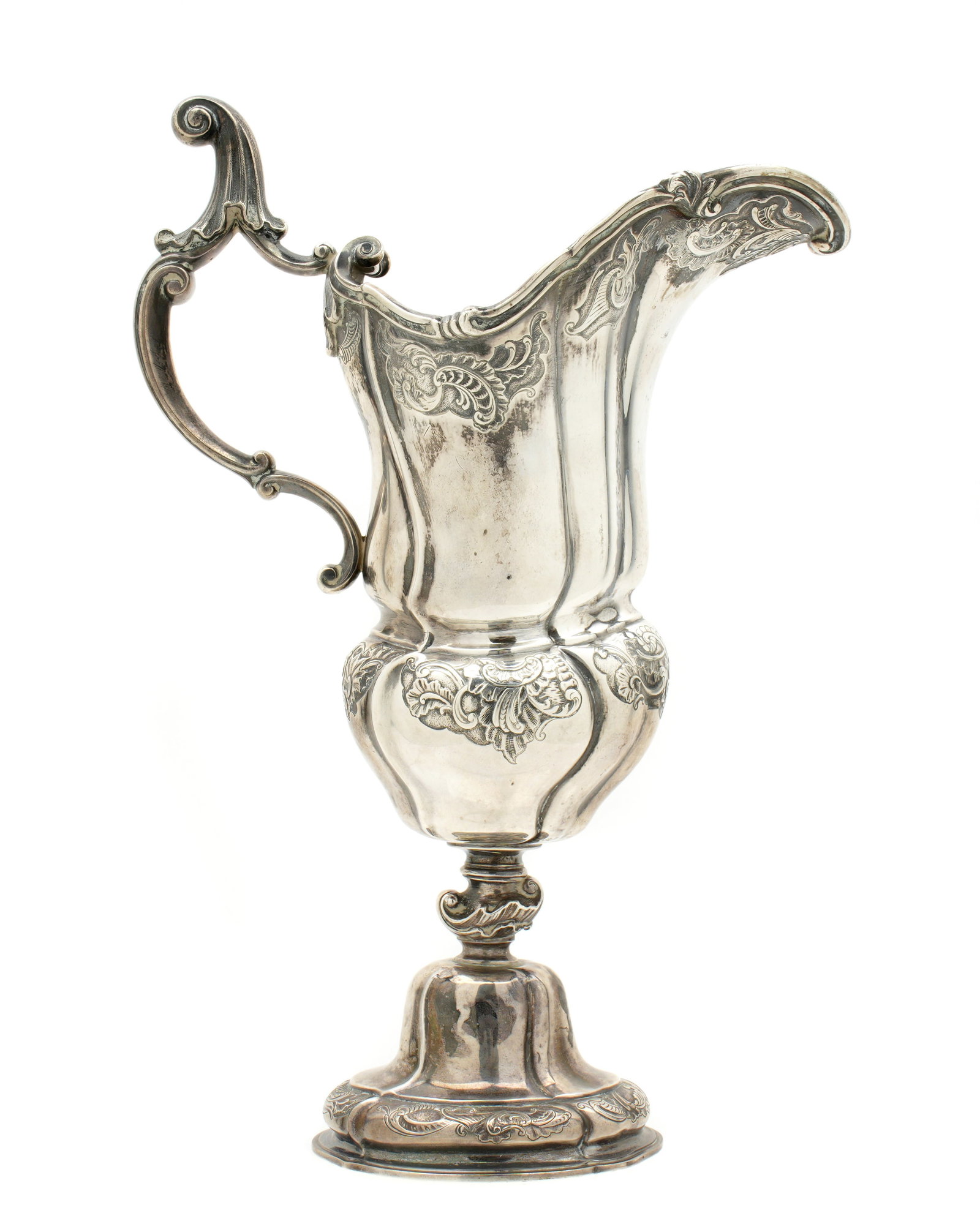 1900 Michelsen Danish Sterling Silver Wine Ewer: Sterling silver wine ewer / pitcher engraved and embossed foliate scroll motifs. Well marked on base with Michelsen crown mark, Simon Groth assay mark, 1900 tower mark, 925. Overall 12" h. x 8.25". Ap