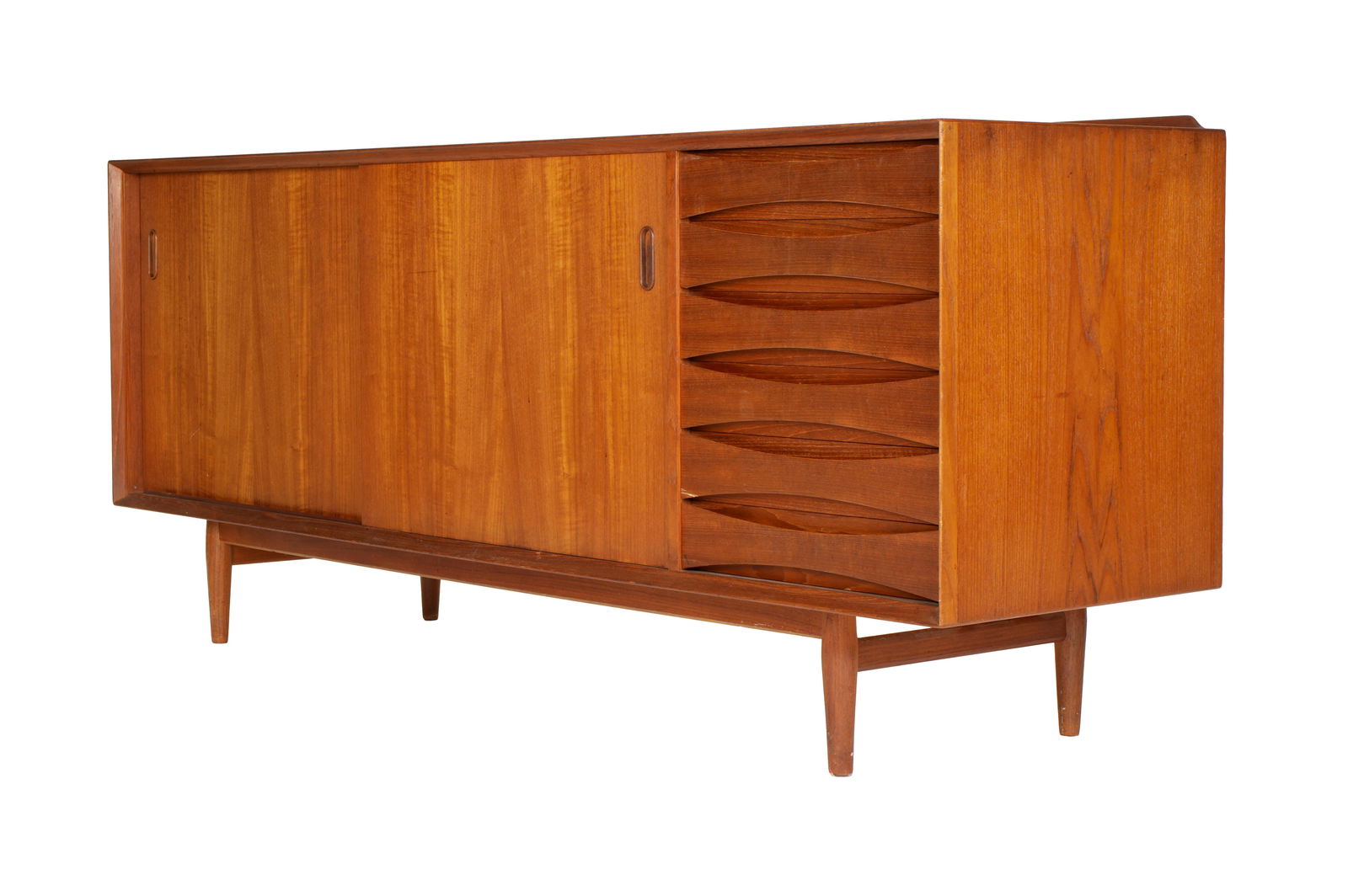 Arne Vodder for Sibast Teak Credenza / Sideboard: Designed by Arne Vodder for Sibast, teak credenza with five drawer, two reversible sliding doors, single adjustable shelf behind each door. On four legs, labels removed at some time. Overall 30.5" h.