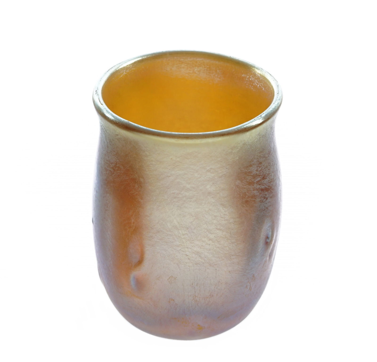 Diminutive Tiffany Gold Favrile Glass Jigger Cup: Small Tiffany Favrile iridescent gold jigger cup, slightly flared rim, pinched accents on body, signed L.C.T. Favrile. Overall 1.75" h. x 1.25".