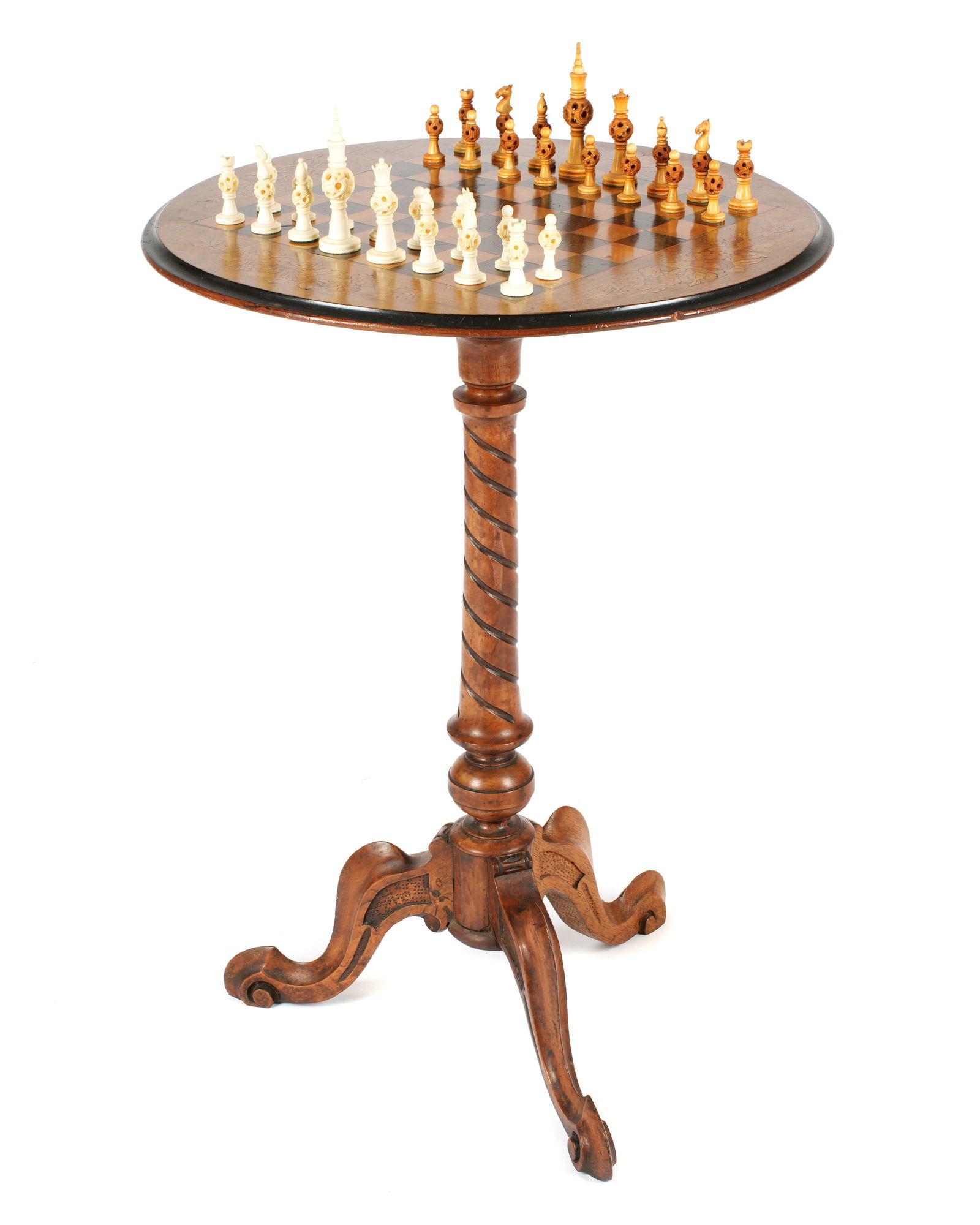 Marquetry Inlaid Chess Board Table: Round top, inlaid chess board and marquetry floral sprays. Carved and turned shaft support. Carved splayed legs, overall 28.25" h. x 20". Sold with carved bone chess pieces. From an important Cape Tow