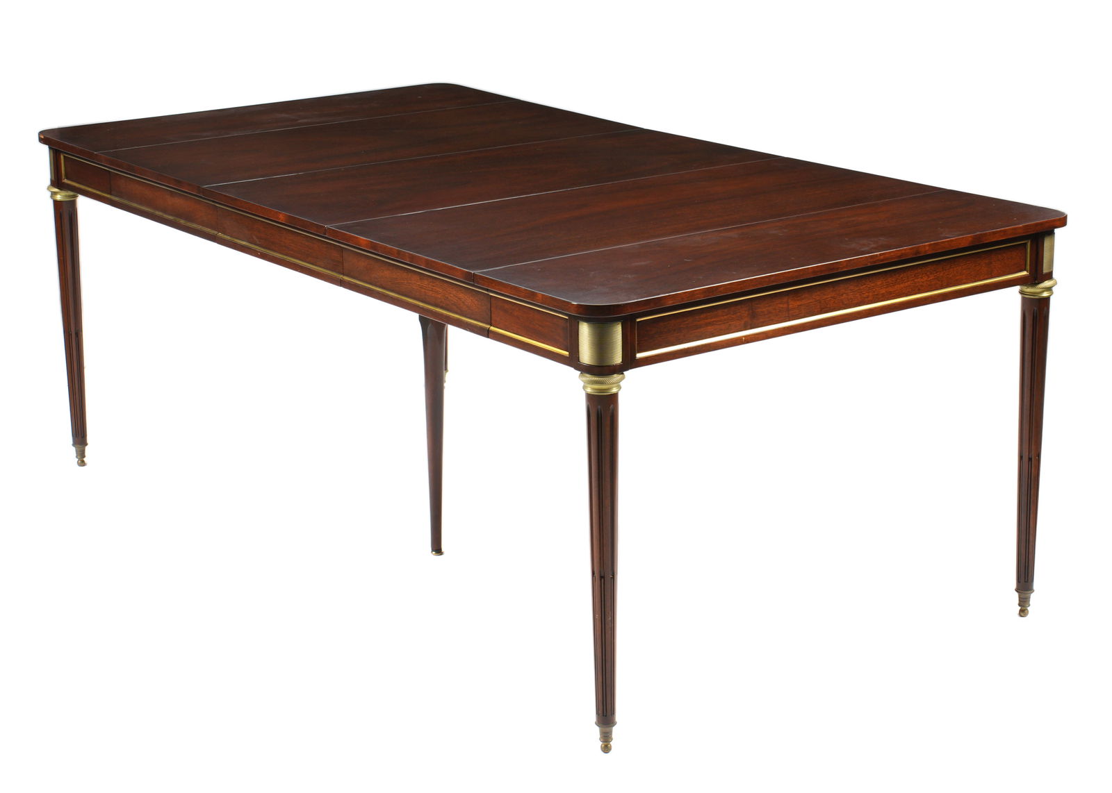 French Louis XVI Style Maison Jansen Tribute Mahogany Expansion Table: Rectangular mahogany top and frame, applied brass accents on apron and joints. Fluted tapered legs ending in brass feet. 29.5" h. x 42.25" x 24.5". Sold with three 17.75" leaves and case for leaves, 4
