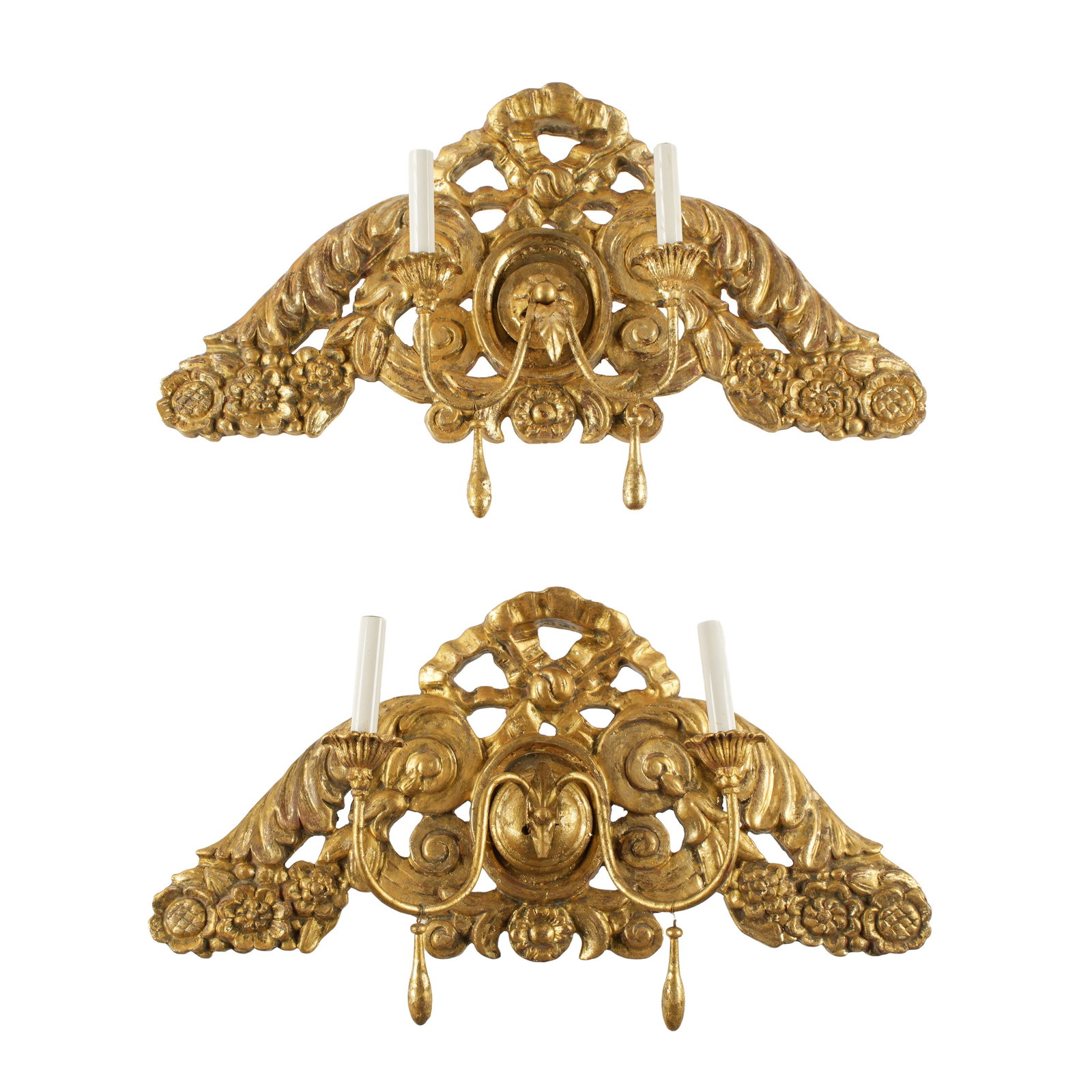 Pair Antique Italian Carved Gilt Wood Sconces: Pair carved gilt wood sconces, ribbon, acanthus leaf and floral medallion motifs. Two electrified arms, single socket each. Overall 13.5" h. x 28" x 5". Condition: Wear to gilt.