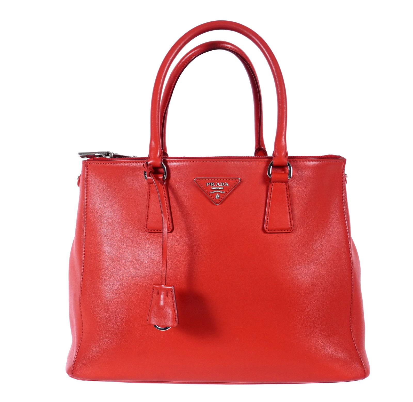 Prada Red Galleria Saffiano Leather Tote Bag: Galleria tote bag / purse by Prada in red saffiano leather, silvered zipper pulls and key ring, overall 9.75" h. x 13" x 6" excluding handles. Sold with unnamed scarf. Overall condition excellent with