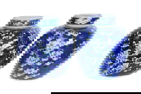 Pair Chinese Porcelain Blue White Plum Ginger Jars: Squat form porcelain lidded ginger jars, cobalt blue and white decorated with flowering plum branches. One bears blue underglaze double ring mark to base, other unmarked. Overall 9.75" h. x 8". Condit