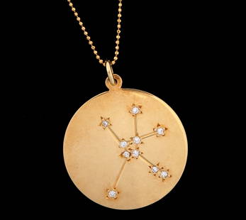 18K & Diamond Cancer Zodiac Pendant 14k Chain: 18k yellow gold astronomical Zodiac symbol for Cancer with 10 accent diamond stars, marked on back, 1 1.25" dia.. Sold with