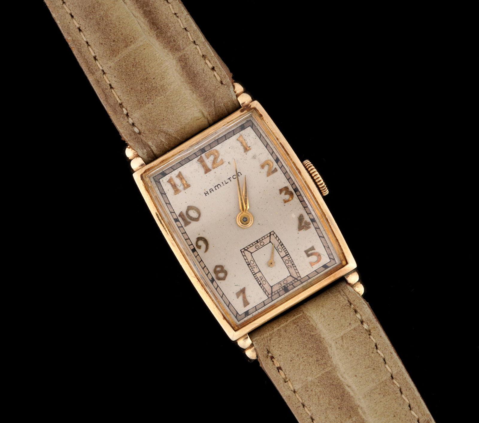 Vintage Hamilton Gold Filled Ladies Wrist Watch: Hamilton ladies manual wind wrist watch, 21mm x 32mm 10k yellow gold filled case, brushed metal dial, leather band, 8.5". Condition: Wear and scratches to case. Minor scratches to crystal. Currently r