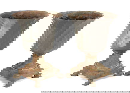 Pair Large Cast Iron Fluted Garden Urns: Flared and fluted neoclassical style planter bowls over square base, all on four paw feet. Unmarked. Overall 36" h. xx 37.75". Condition: Obvious signs of weathering, rust. Shippers note very heavy.