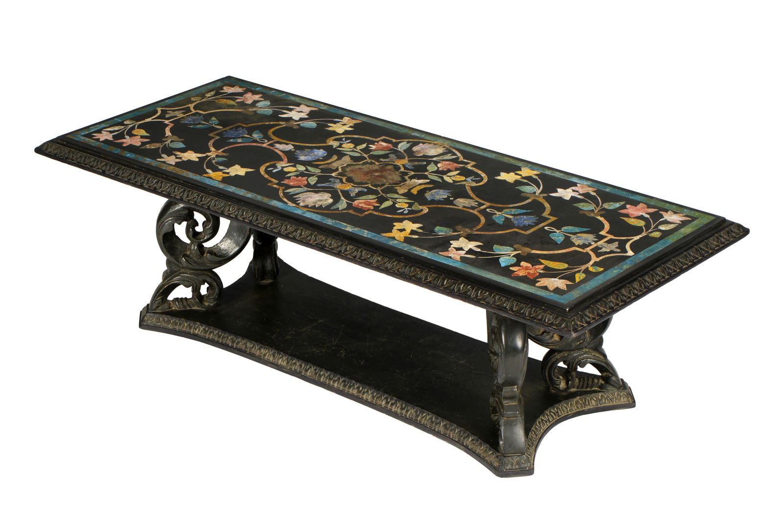Italian Pietra Dura Inlaid Coffee Table: Rectangular pietra dura stone inlaid top, foliate and floral scroll motif. Ebonized carved wood trim, acanthus leaf scroll supports, and base. Overall 17.75" h. x 57" x 24". Condition: Scratches to to