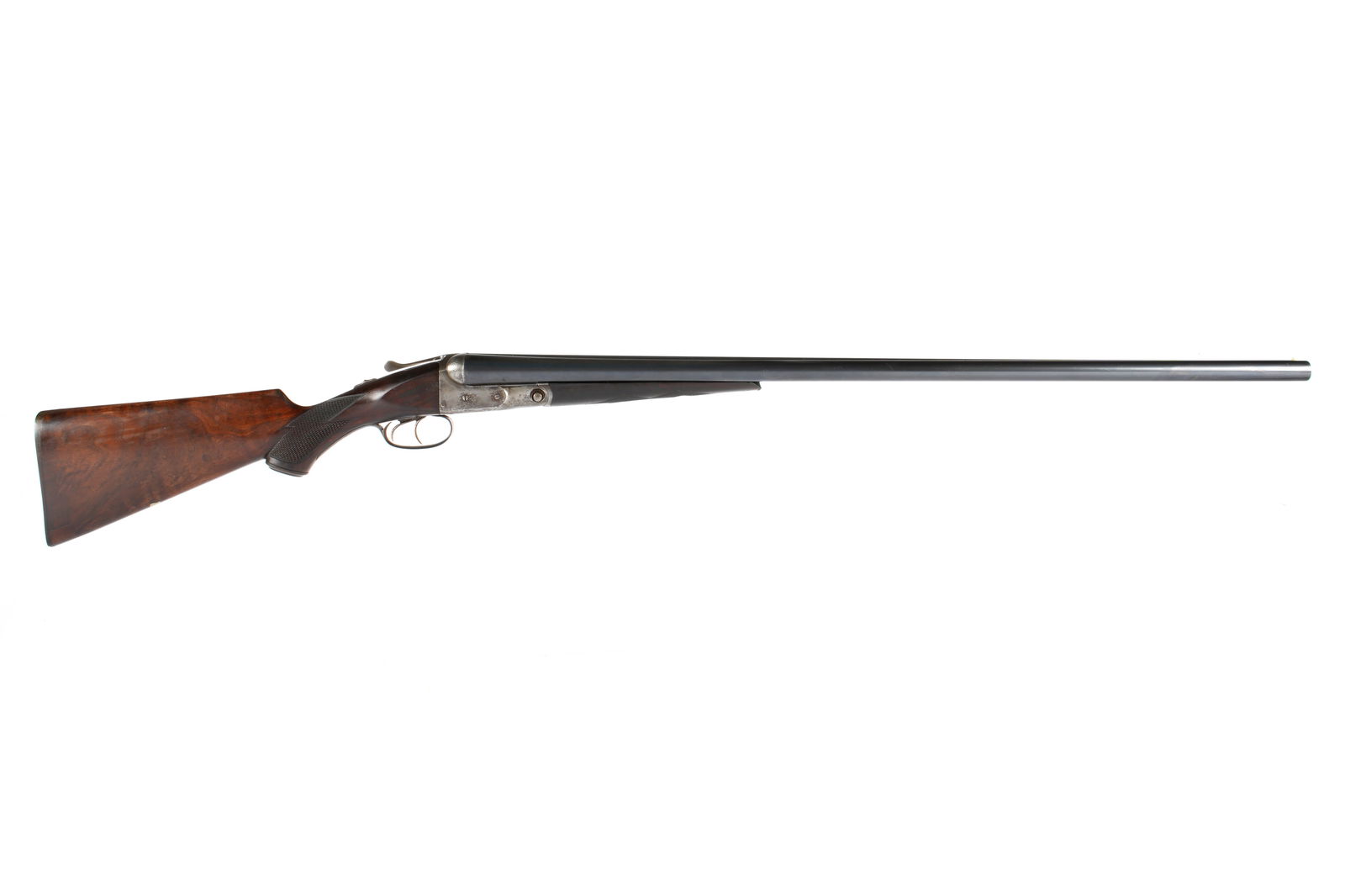 Parker Brothers 12 Gauge Double Barrel Shotgun: 1921, serial number 193341, hammerless side by side, grade PH, Parker Steel barrel length 32", 14.25" length to pull, checkered walnut stock, overall 48" long. Condition: Minor spotting to barrel exte
