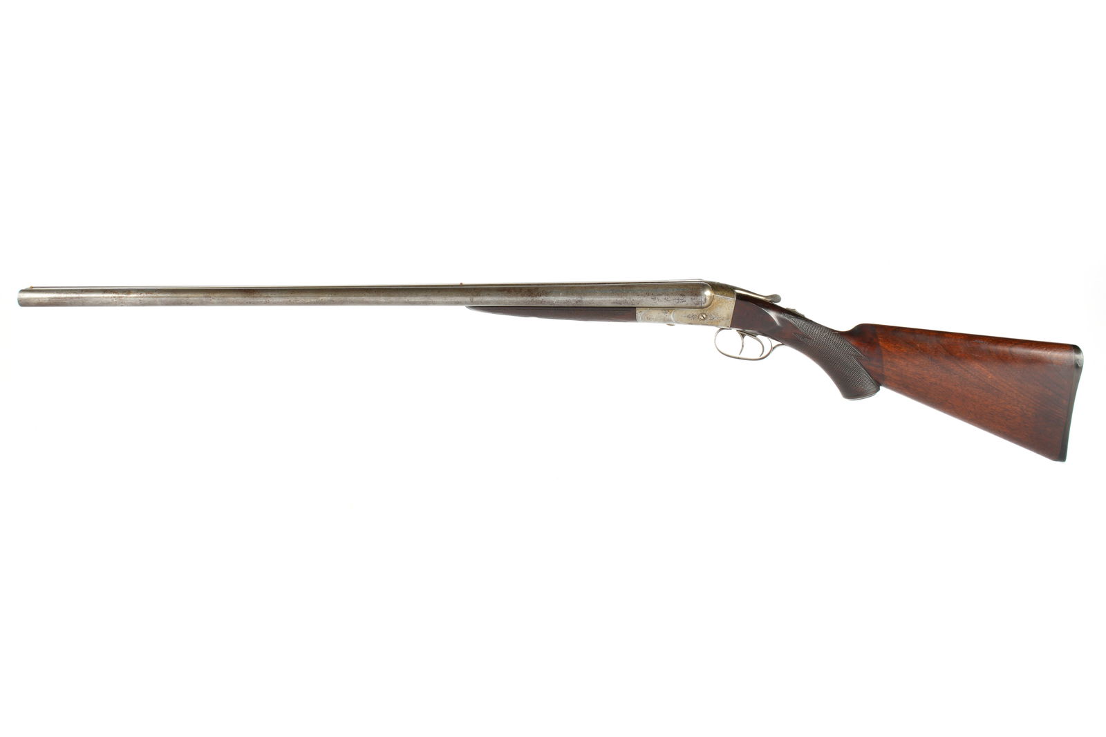 Forehand Arms 12 Gauge Double Barrel Shotgun: Serial number 2352, hammerless side by side, barrel length 30.25", 14" length to pull, checkered walnut stock, overall 46" long. Condition: Surface spotting and minor dings to barrel exteriors. Stock