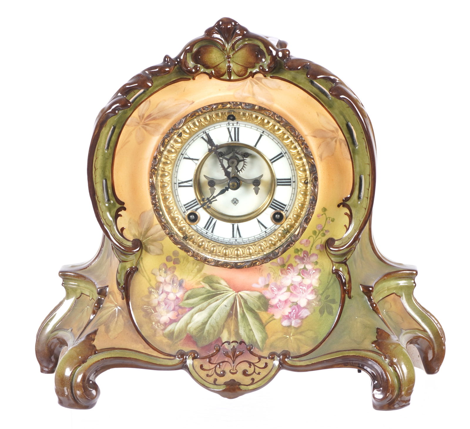 Royal Bonn La Riviere Ansonia Mantel Clock: Royal Bonn "La Riviere" porcelain mantel clock, hand painted floral decoration. Enamel dial with open escapement, marked Ansonia. Ansonia time and gong strike movement. Overall 12.25" h. x 14" x 5.5".