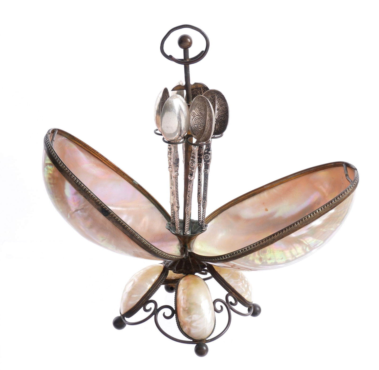 Mother of Pearl Shell Form Caviar Spoon Caddy: Mother of pearl shell form caddy with hinged drop front lid, brass frame, splayed base with four mother of pearl cabochons, no visible markings. Caddy hold six engraved German .800 silver caviar spoon