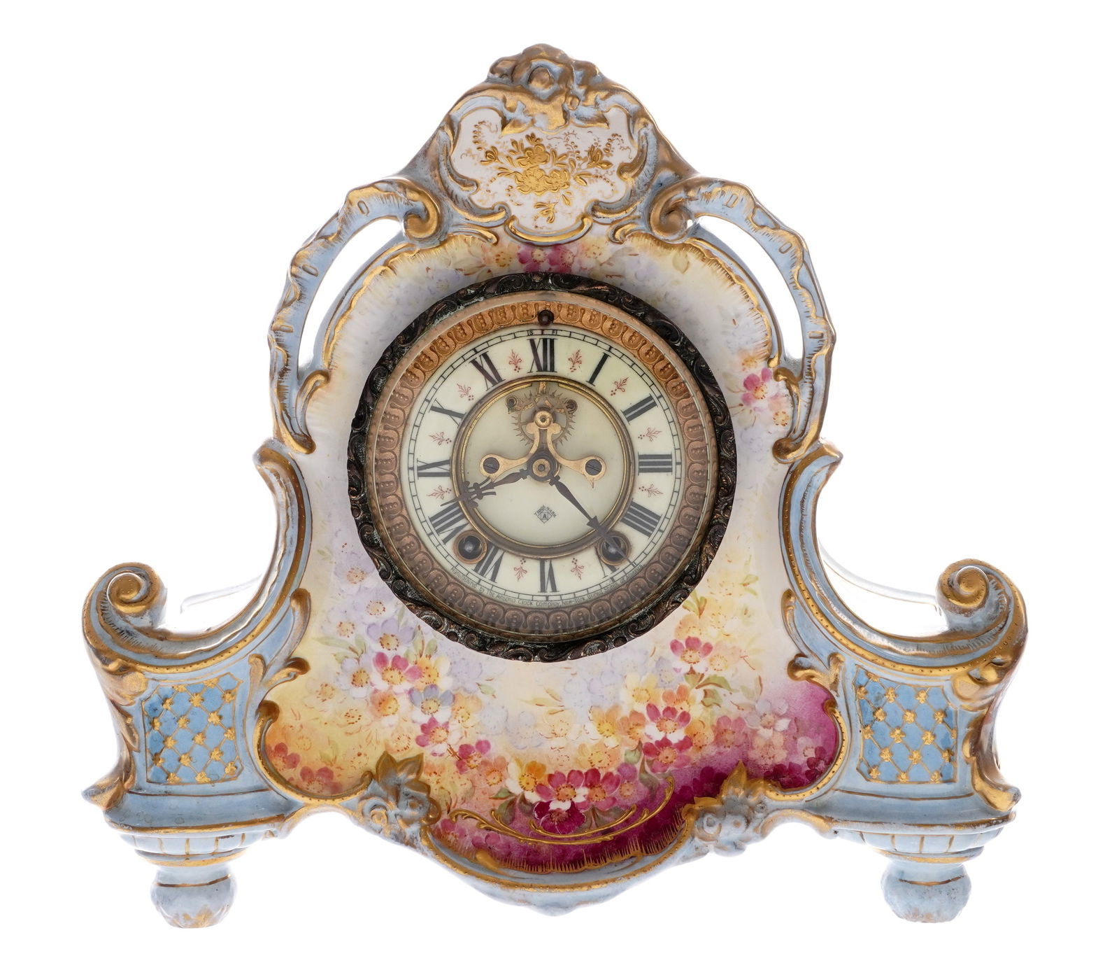 Royal Bonn Ansonia Porcelain Mantel Clock: Royal Bonn porcelain mantel clock, hand painted floral decoration and gilt accents. Enamel dial with open escapement, marked Ansonia. Ansonia time and gong strike movement. Overall 12.25" h. x 13" x 5