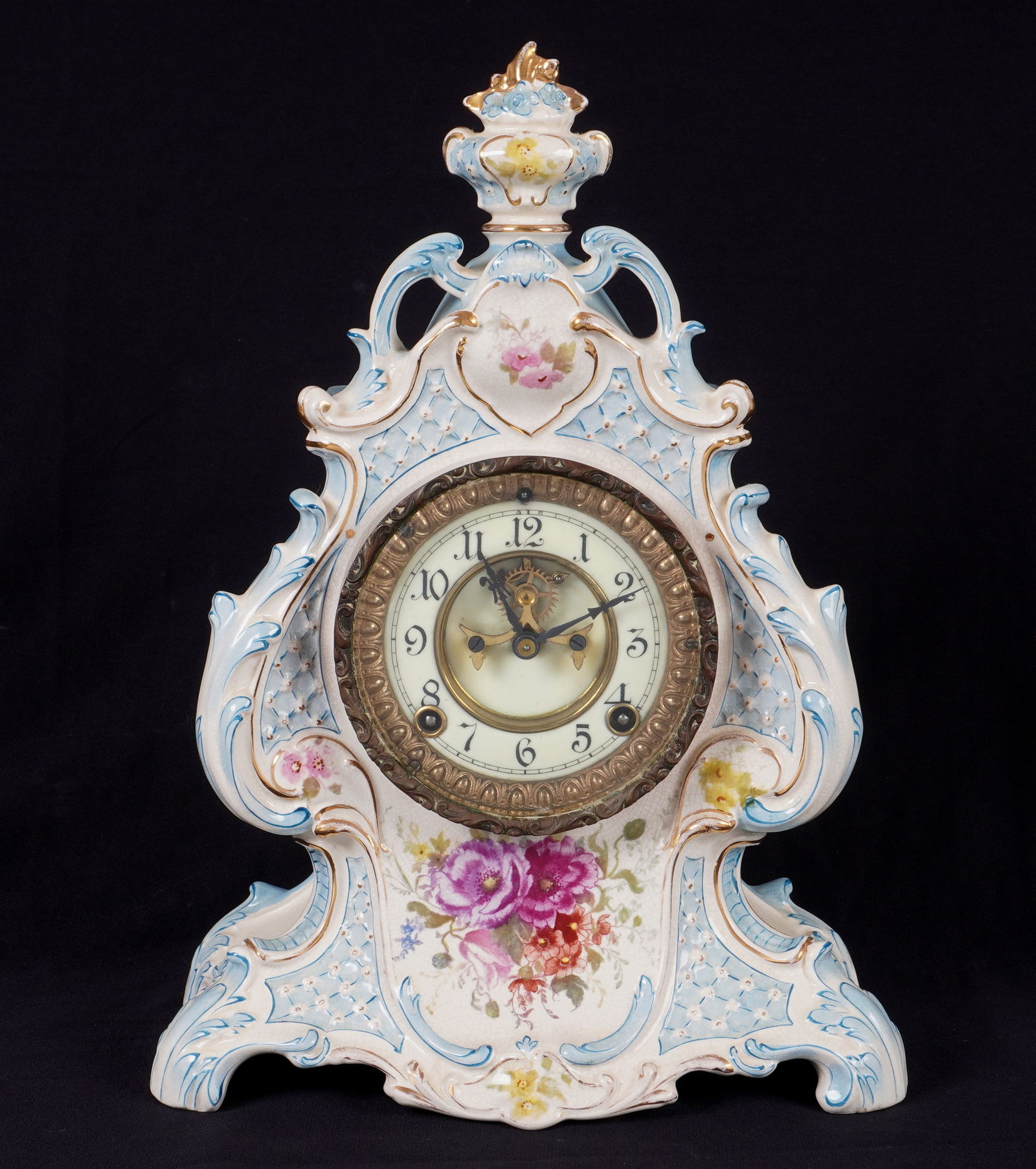 Royal Bonn Ansonia La Loire Mantel Clock: Royal Bonn "La Loire" porcelain case, hand painted floral motif. Enamel dial with open escapement, unmarked. Ansonia time and gong strike movement, overall 15" h .x 11" x 5.25". Condition: Crazing, mi