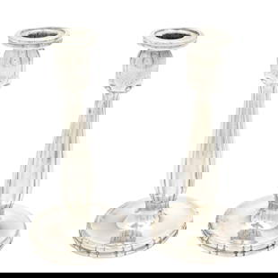 Pair Georg Jensen Sterling Candlesticks #119: Pair of sterling silver hand chased candlesticks by Georg Jensen, pattern 119, marks are slightly obscured on base. Overall 7.5" h. x 3.5". Approx. 13.2 troy oz. Condition: Scratches, damage to marks.